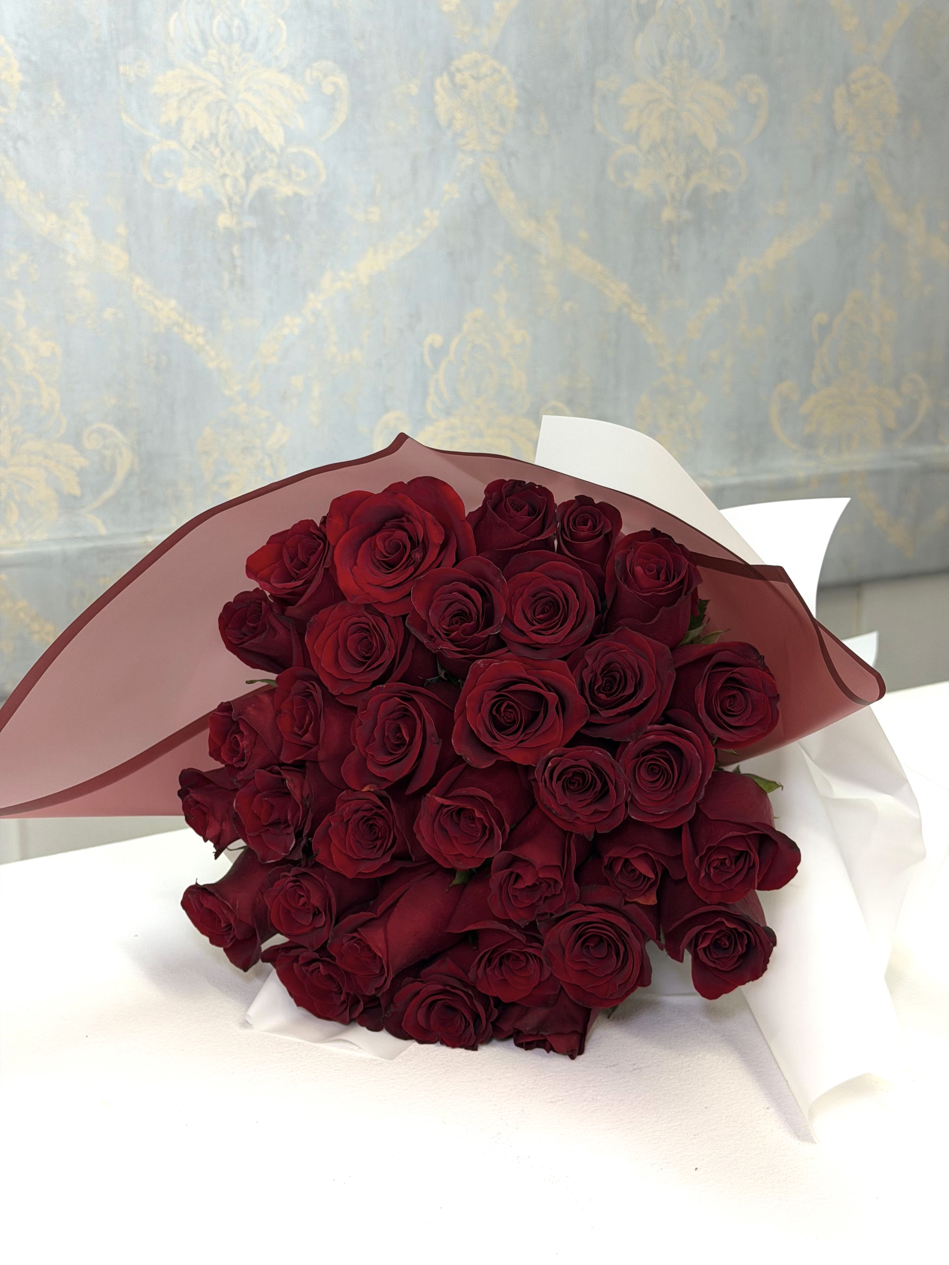 40 Reasons to Love - Make a breathtaking impression with our 40 Reasons to Love bouquet  This luxurious floral design features 40 premium red roses beautifully wrapped in elegant luxury paper that enhances the beauty and richness of every bloom.  A timeless bouquet that represents love, passion, and admiration — perfect for anniversaries, romantic surprises, birthdays, or any special moment worth remembering.    A classic, elegant, and unforgettable bouquet designed to steal hearts instantly.