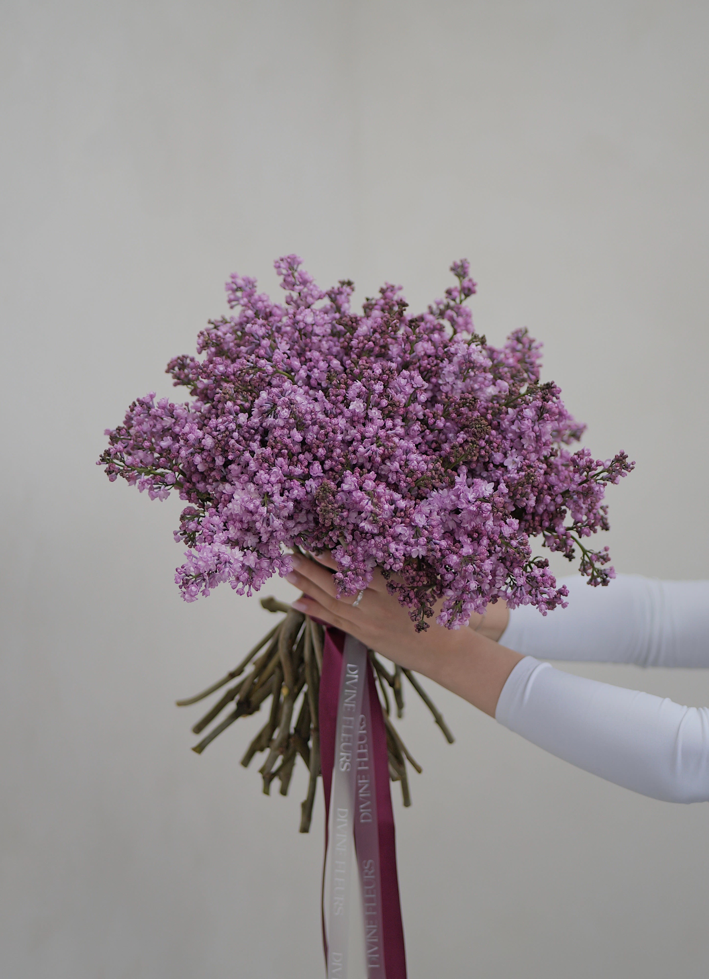 Spring Serenade - Soft clusters of lilac blooms hand‑tied with premium satin ribbons. Elegant, fragrant, and perfect for adding a touch of springtime serenity to any setting.