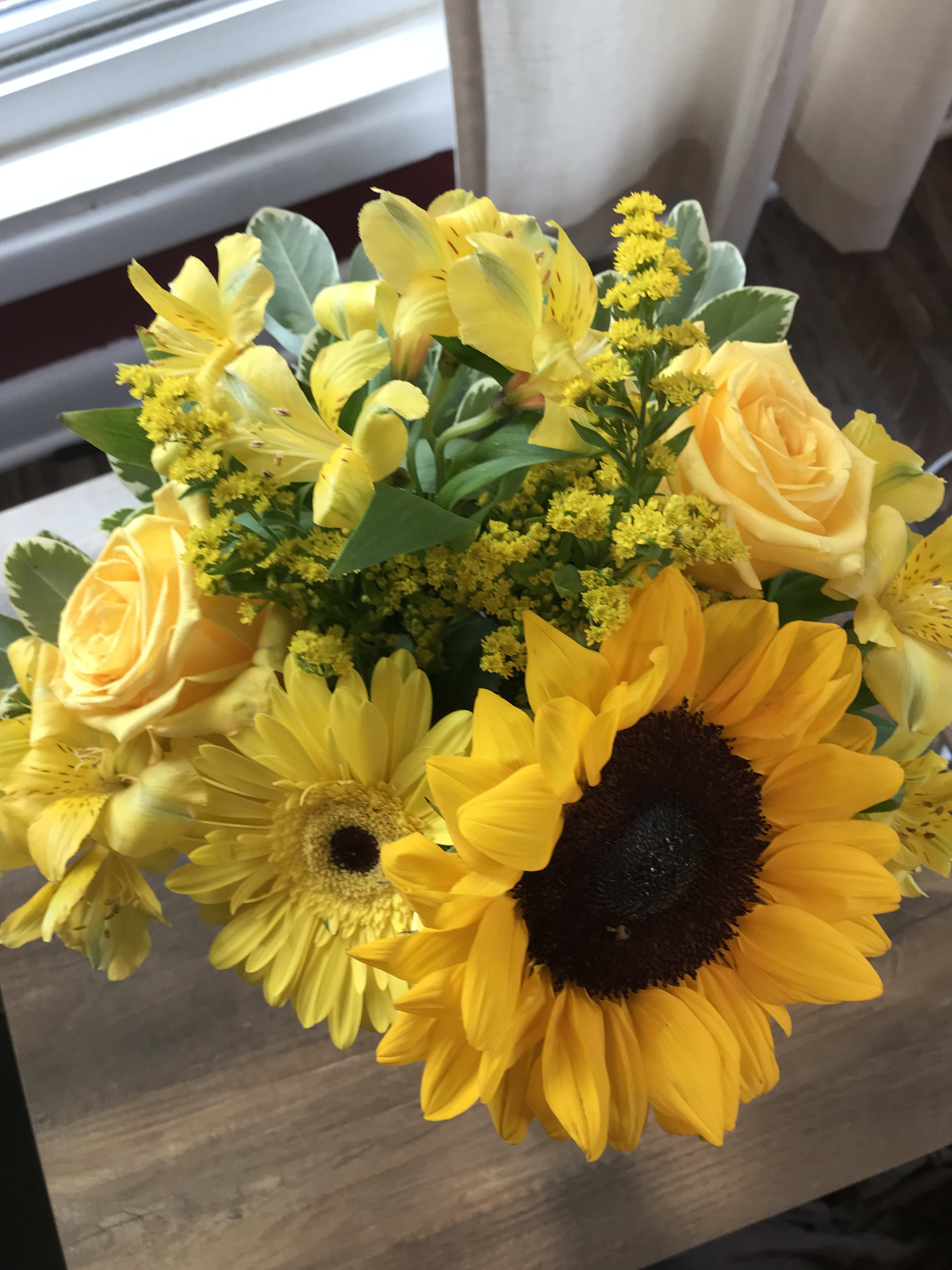 Yellow bouquet with sunflowers, roses, and alstroemeria