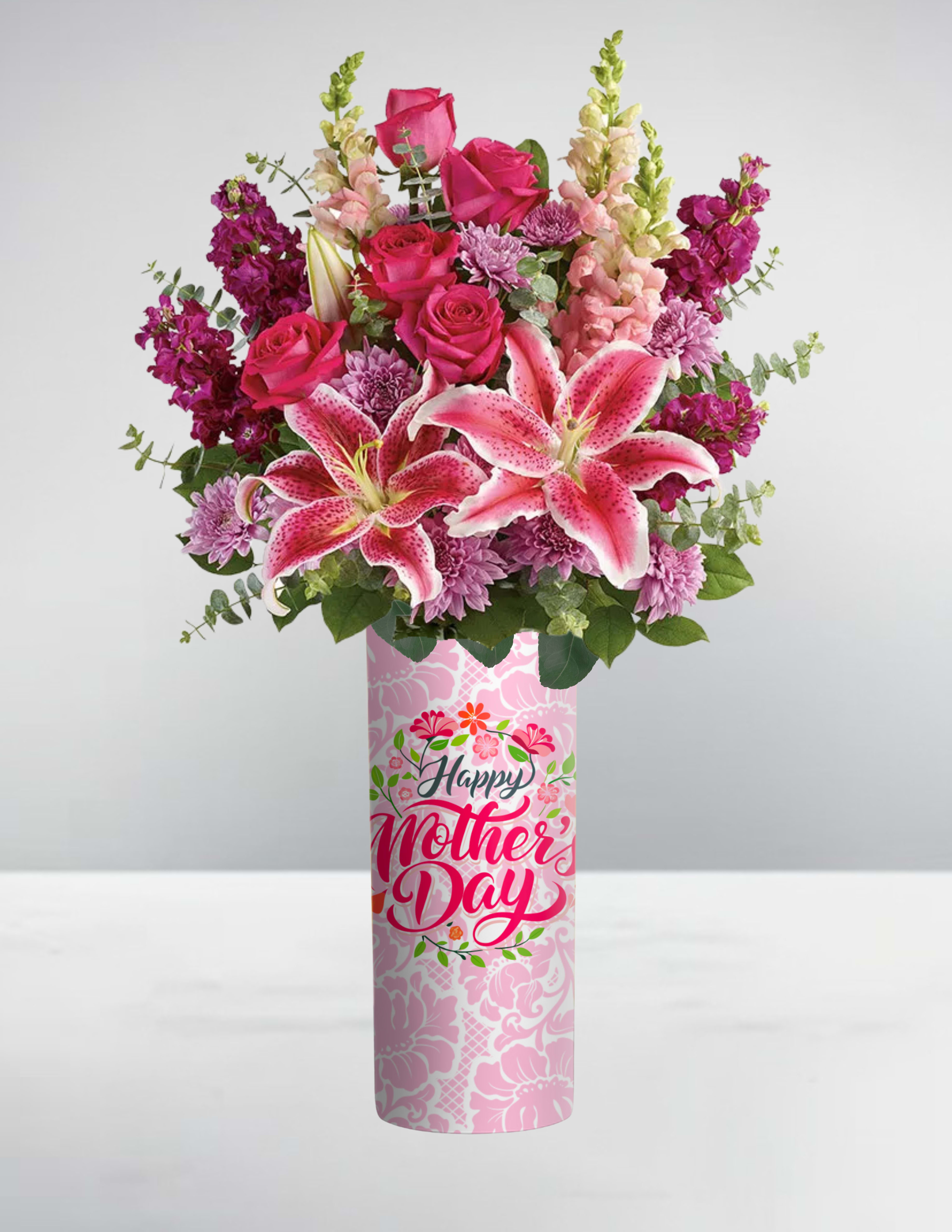 Tall pink Mother’s Day vase with pink lilies, roses, snapdragons, and mums