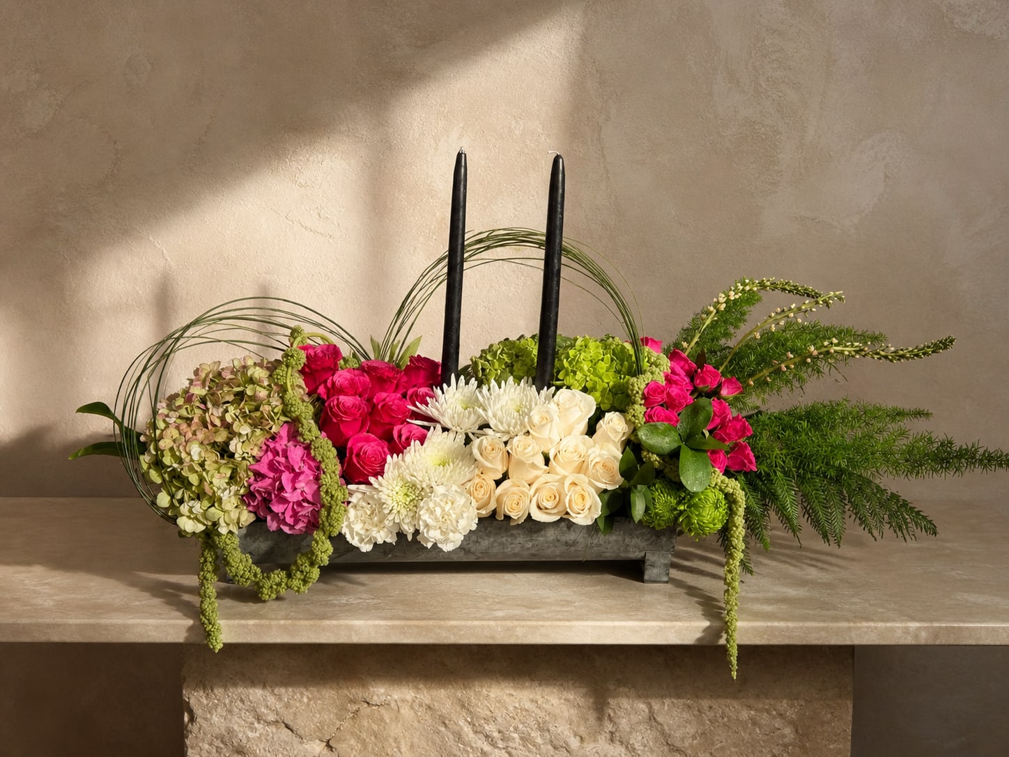 Velvet Garden  - An elegant centerpiece featuring premium roses, hydrangeas, chrysanthemums, and lush greenery paired with modern black candles for a sophisticated and artistic design.