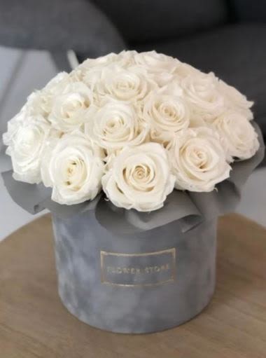 Luxury White Roses in Grey Velvet -  Pet Friendly? YES While Roses themselves are non-toxic to household pets like cats and dogs, the thorns can cause physical injury if chewed. Because these are in a box with floral foam, keep the arrangement away from curious pets to prevent them from ingesting the foam or water.    Human Allergy Note : No major allergy-triggering flowers noted. Roses have heavy pollen that doesn’t easily become airborne, making them a safer choice for most.   Care &amp; Longevity : Since these are arranged in a box, they typically sit in water-soaked floral foam. To extend their life, add a small amount of water to the center of the box every two days to keep the foam moist. Keep the arrangement away from direct sunlight, heat sources, or AC vents, and remove any petals that begin to fade to keep the rest of the blooms healthy.    Best Occasions &amp; Situations :  - Congratulations flower — Celebrate promotions or milestones  - Housewarming — Elegant gift for a new home  - Romance/Anniversary — Classic expression of pure love  - Just because — Send timeless beauty any day  - Memorial — Respectful tribute in white  - Fourth of July — Sophisticated host gift  Why Customers Love It : - Gift-ready presentation in a high-end velvet keepsake box. - Timeless color balance that fits any decor style. - Clean, minimalist aesthetic without messy greenery or fillers. - Long-lasting premium roses selected for their petal count and strength.
