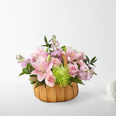 Beautiful Spirit basket -  Pet Friendly? No — Lilies are known to be toxic to cats, and chrysanthemums (Fuji mums) can also pose risks for sensitive pets. Keep this arrangement well out of reach of curious cats and dogs.   Human Allergy Note : There are some pollen-heavy blooms (lilies, mums) that may trigger sensitivities.  If allergies are a concern, keep the arrangement in a well-ventilated area and away from bedrooms.   Care &amp; Longevity : Trim stems at an angle before placing in fresh water. Check daily and refresh water every 1–2 days. Keep out of direct sun, heat, and drafts. Remove wilting blooms promptly to extend the life of the rest.   Best Occasions &amp; Situations : - Memorial service - Get well/comfort - Thinking of you - Anniversary remembrance - Celebration of life - New baby gift - Birthday remembrance   Why Customers Love It : - Peaceful color balance works for sympathy and remembrance - Classic basket shape feels gift-ready and easy to display - Fresh selection with trusted staples like rose and lily - Versatile for services, homes, or offices - Hand-arranged for a personal, caring touch