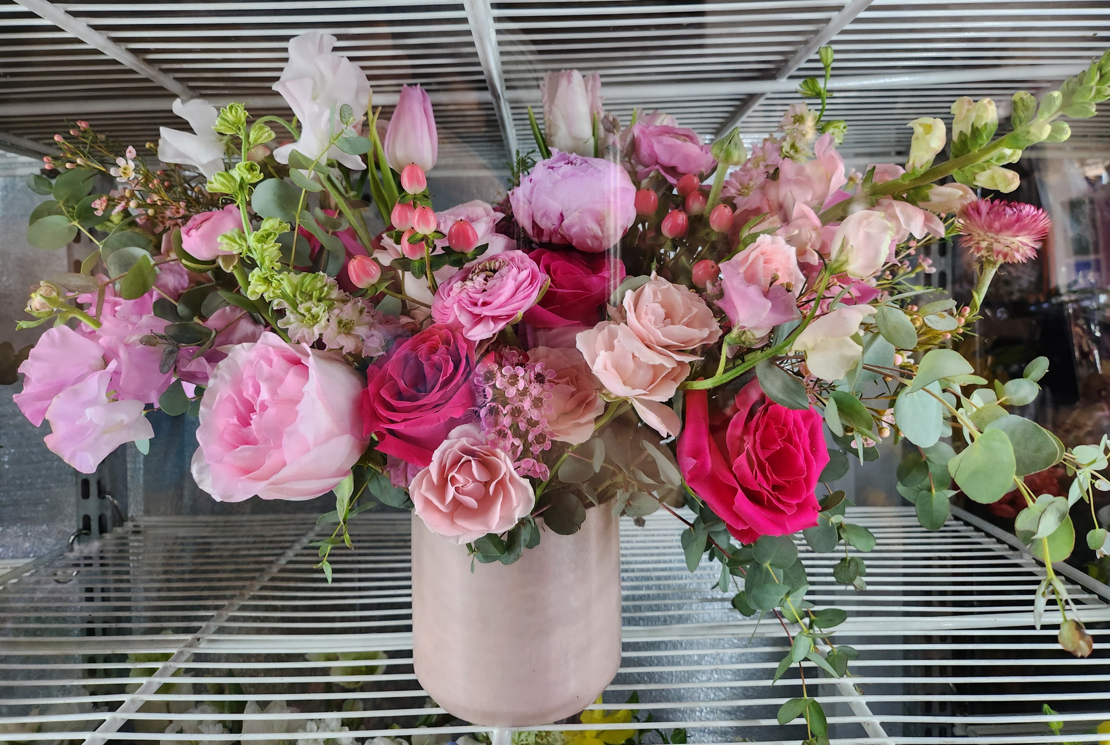 Pink and white mixed bouquet in a blush vase