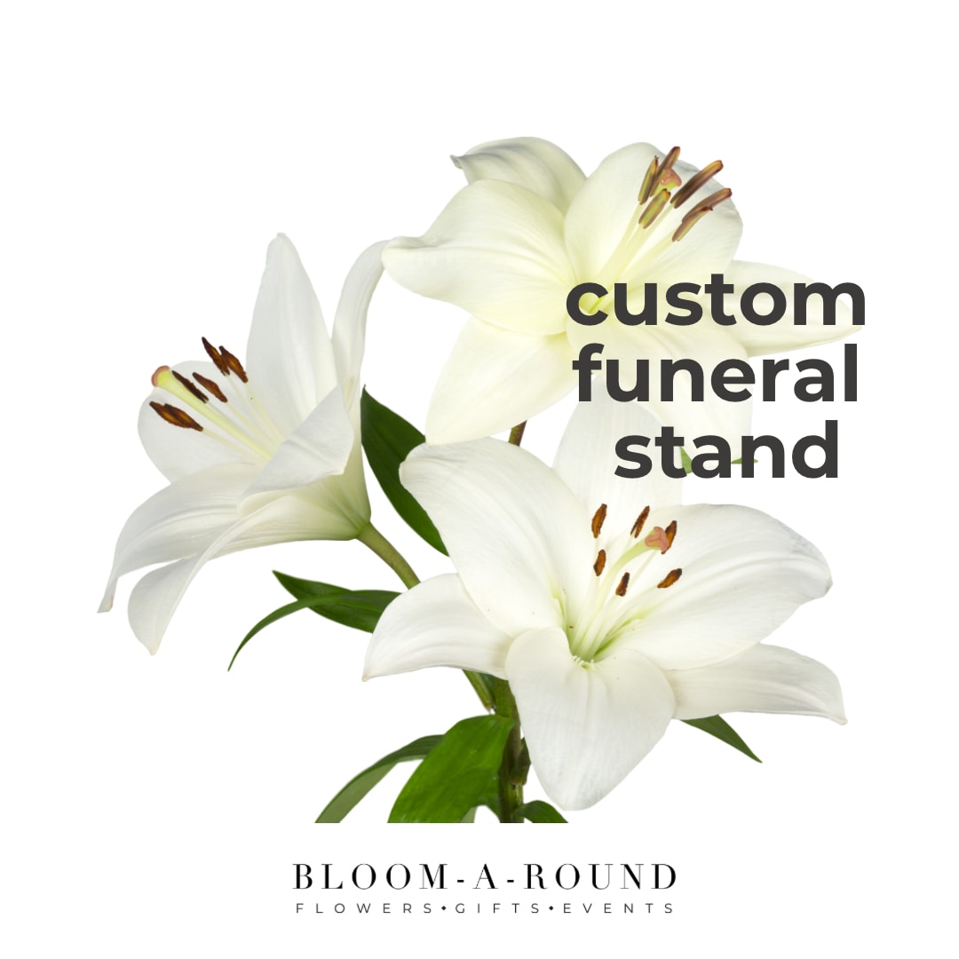 White lilies with green leaves and text reading custom funeral stand