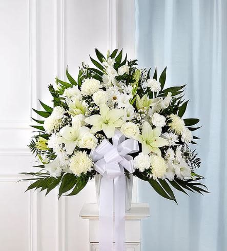 Heartfelt Sympathies White Funeral Standing Basket - Pet Friendly? No. This arrangement contains Oriental Lilies, which are highly toxic to cats, and Chrysanthemums, which can cause illness in dogs.  Keep out of reach; avoid homes with curious cats.   Human Allergy Note : This arrangement contains pollen-heavy Lilies and Chrysanthemums. To reduce irritation, we recommend removing the orange anthers from the lilies as they open and keeping the room well-ventilated.  Care &amp; Longevity : As this is a basket arrangement set in floral foam, it requires daily attention. Gently pour water into the center of the basket to keep the foam saturated. Avoid placing the flowers in direct sunlight, near heating vents, or in drafty areas. Remove any fading blooms or foliage to keep the display looking fresh for the duration of the services.   Best Occasions &amp; Situations : - Funeral service or memorial - Church or chapel floral tribute - Expression of deep sympathy - Celebration of life - Religious ceremony - Graveside service accompaniment  Why Customers Love It : - Stunning Scale: Provides a significant visual impact at a memorial service. - Classic Elegance: The all-white palette is a timeless choice for expressing respect. - High-Quality Blooms: Features premium lilies and roses for a sophisticated feel. - Ready for Display: Arrives fully arranged in a basket, making it easy for funeral staff to position.