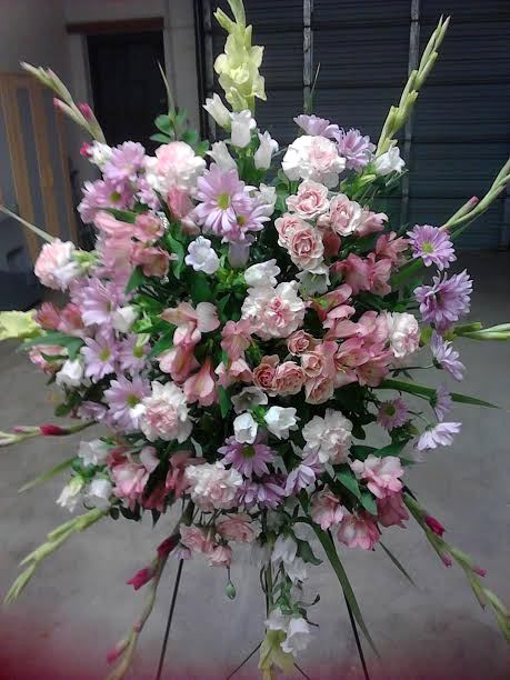Large pastel floral spray with pink, white, and lavender blooms