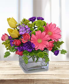 Colorful mixed bouquet in a clear glass vase