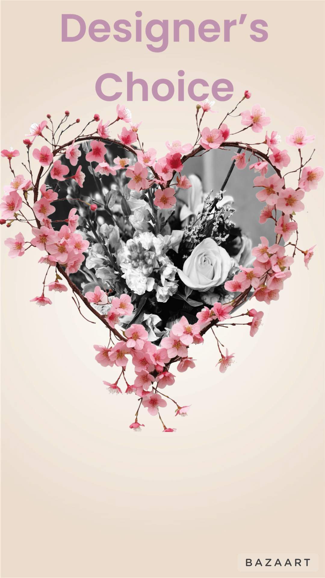 Heart-shaped floral design with pink blossoms around a black-and-white bouquet