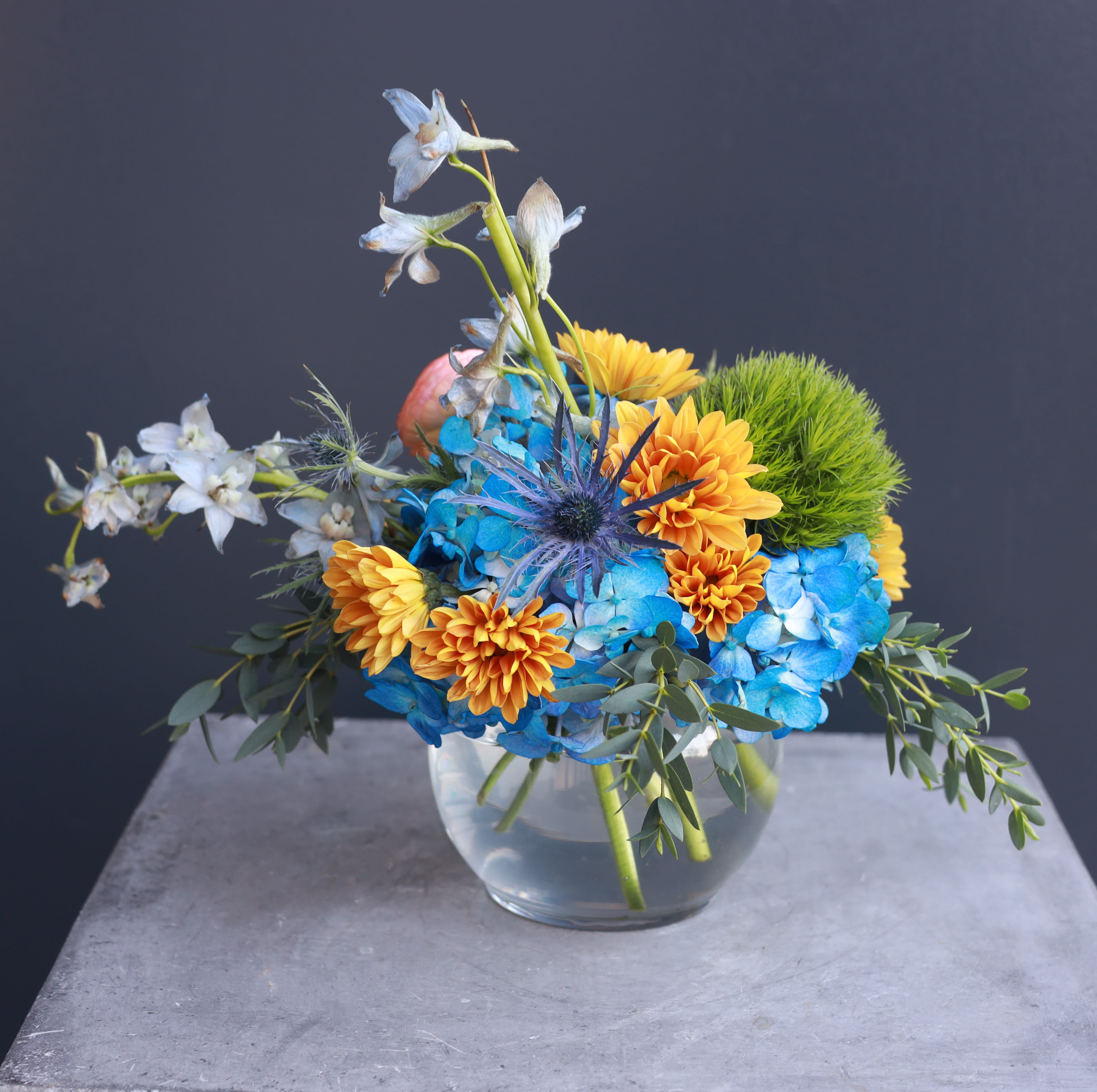 Color Dynamite - A small fun colorful arrangement that is a dynamite of color and joy!