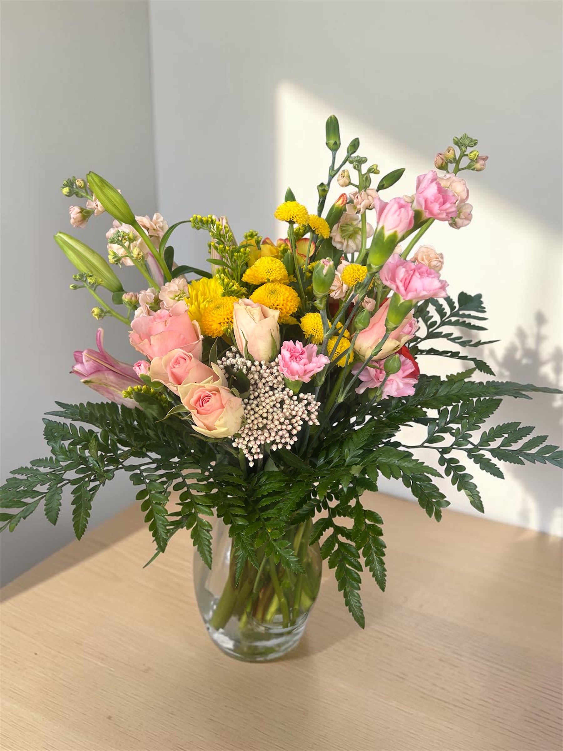Sunrise Symphony - A dreamy blend of soft light pink and delicate pale yellow blooms, this arrangemen inspired by the gentle beauty of sunrise. Featuring airy pastel tones and romantic texture, this bouquet radiates warmth, sweetness, and understated luxury.