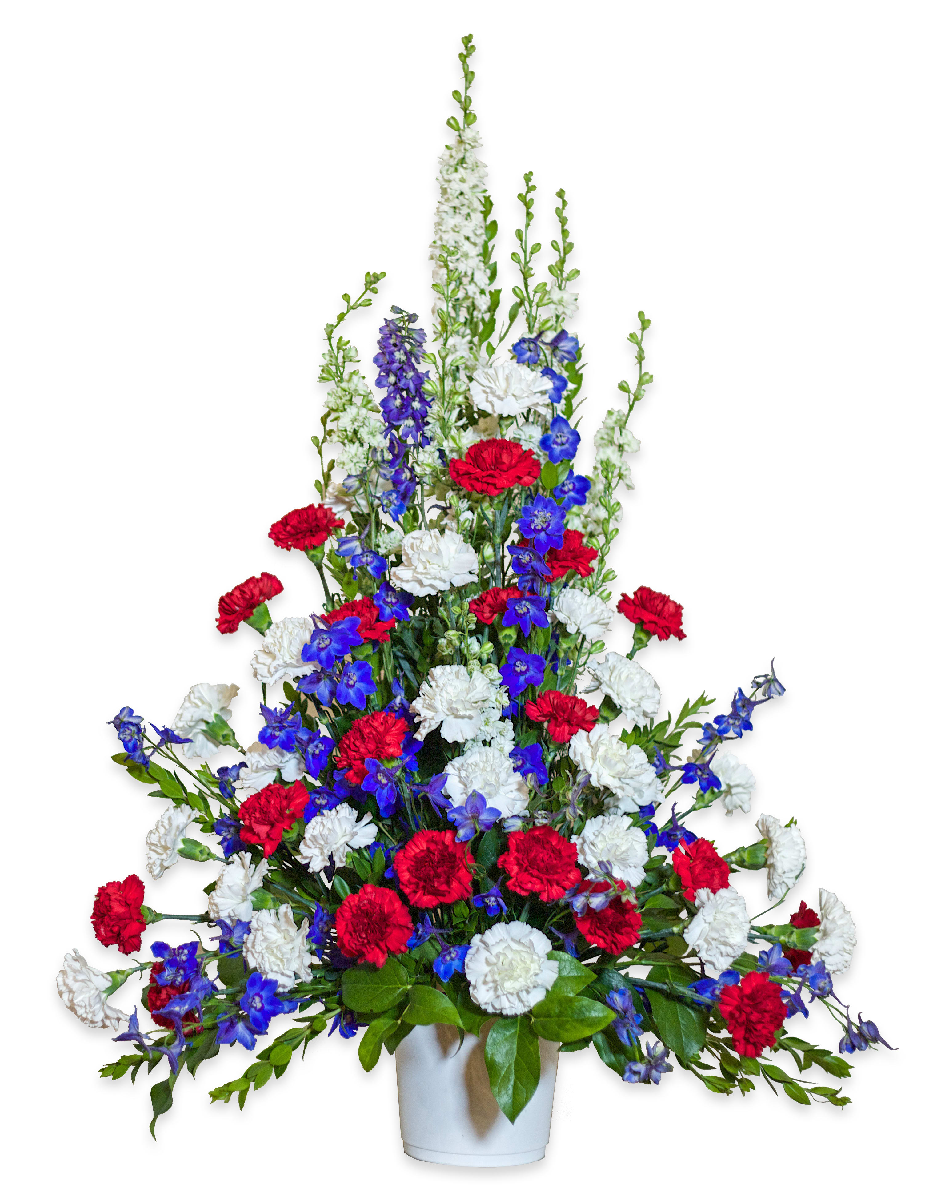 Red, white, and blue floral arrangement in a white vase