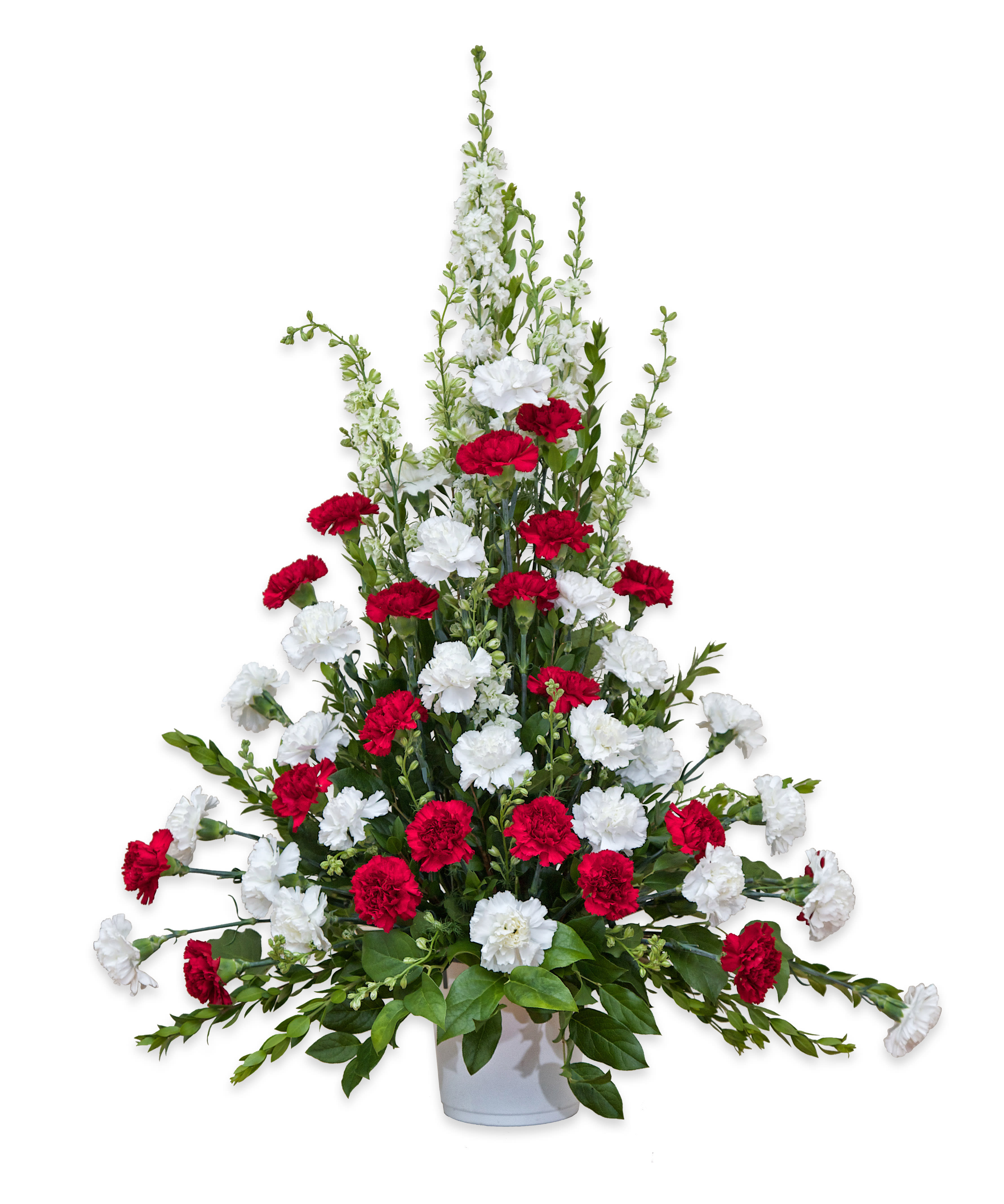 Red and white carnations in a white vase
