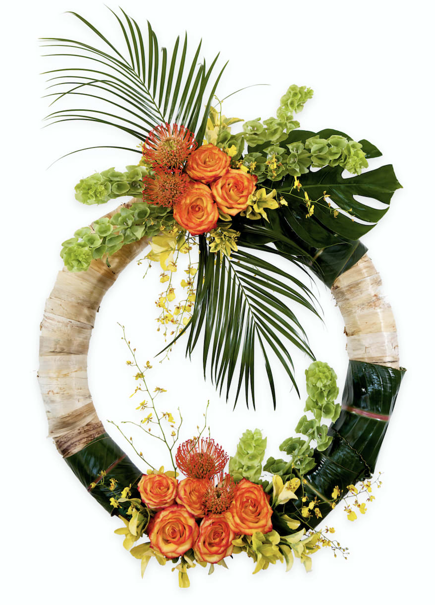 Tropical floral wreath with orange roses and green foliage