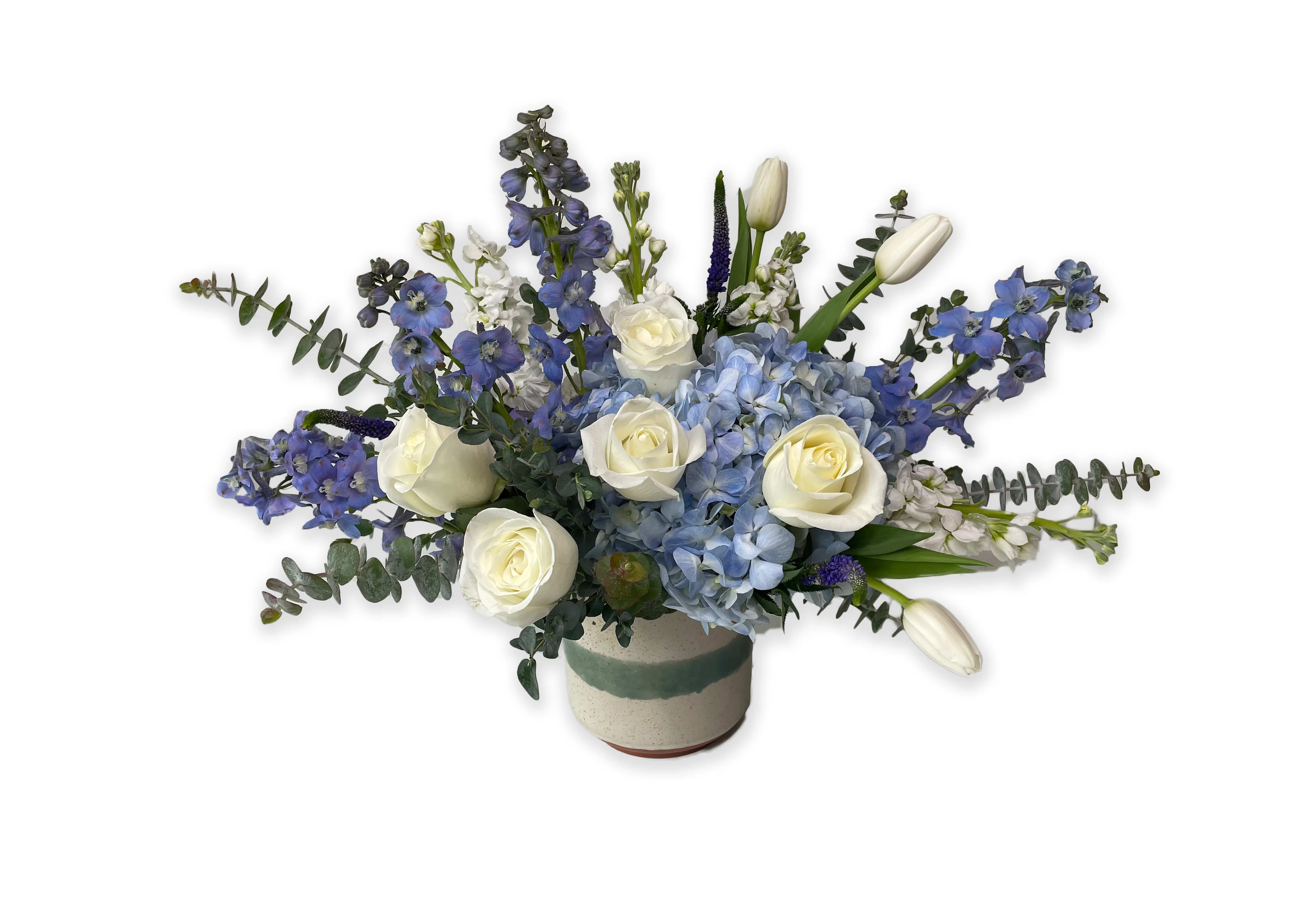 Blue and white floral arrangement in a ceramic vase
