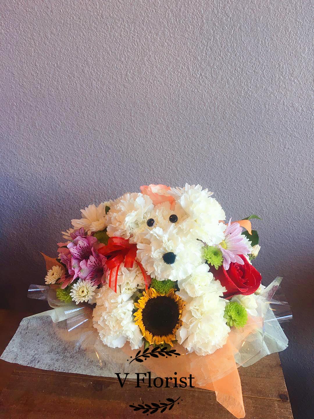 Bouquet shaped like a teddy bear made from white and pink flowers