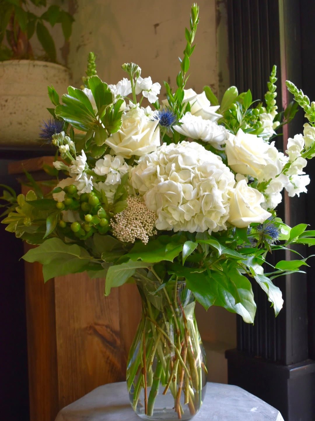 Moonlit Garden - Each arrangement is custom designed, using seasonal, best-of-day blooms. The image shown represents its size, style and temperament, however certain flowers may be substituted to achieve the best quality and longevity for your florals.