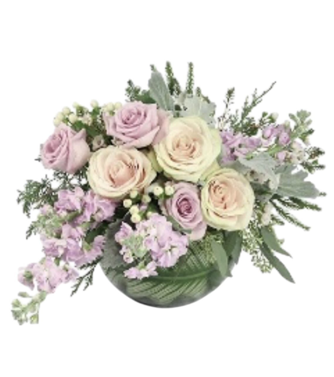 Bouquet of pale pink and cream roses with lavender flowers in a green vase