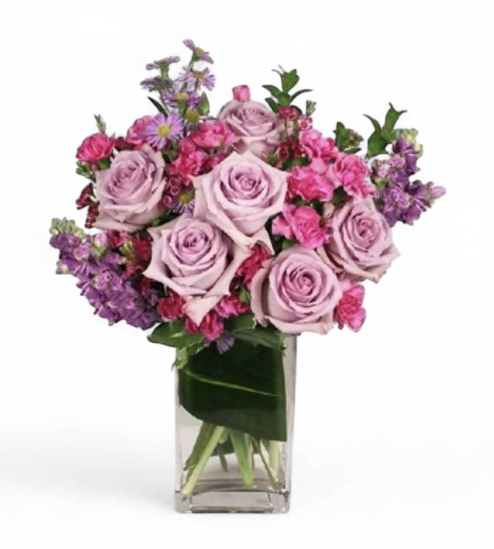 Lavender and pink rose bouquet in a clear glass vase