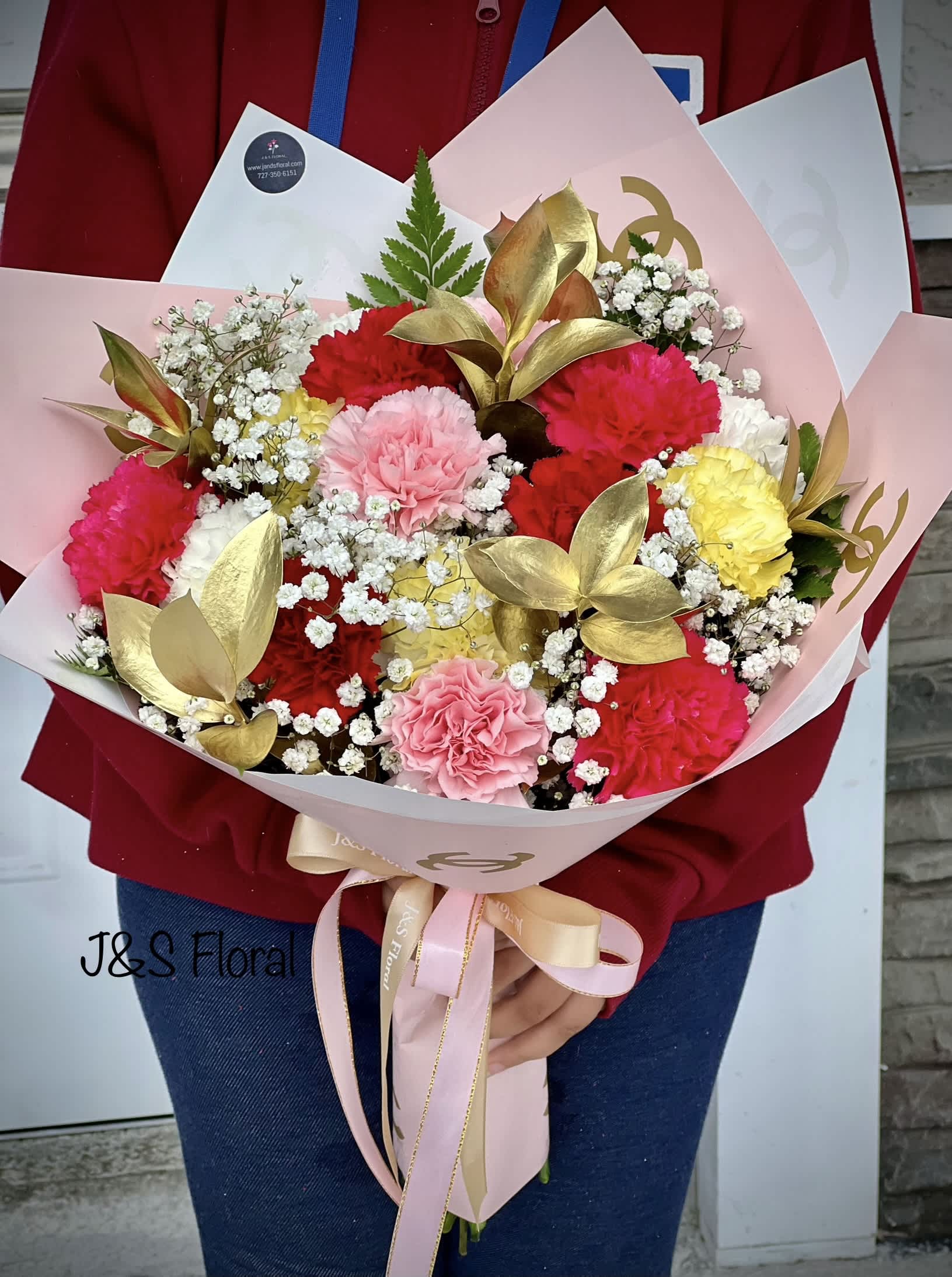 Fiesta Carnation - Introducing our Stunning design Fiesta Carnations! Handmade with beautiful mix carnations and gold ruscus with baby’s breath wrapped with channel floral wrap. Perfect for any special celebration or occasion!