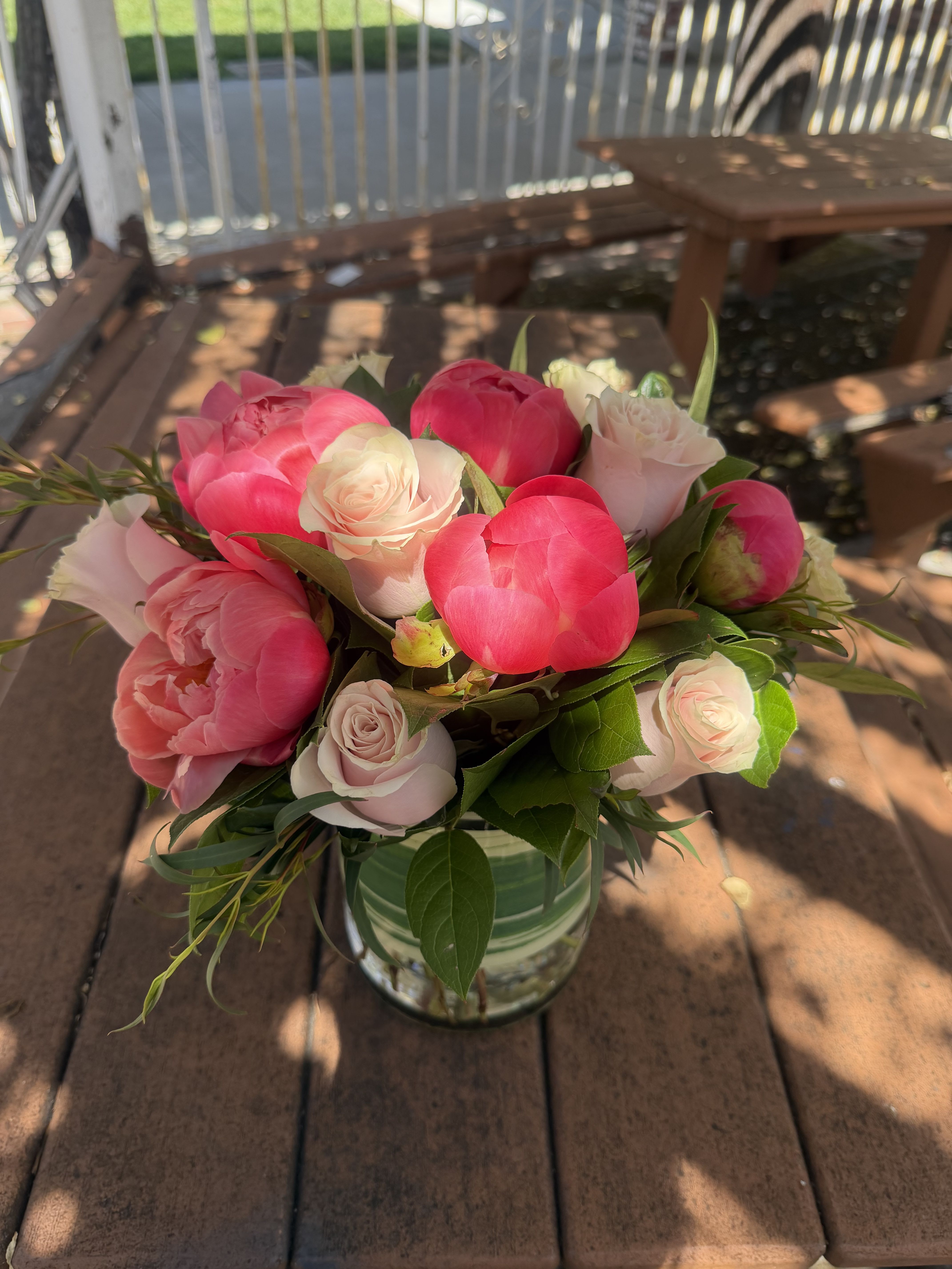 Peonies  &amp; Pink Roses Arrangement  - Lush pink peonies take center stage in this romantic flower arrangement, paired with soft blush and white roses for a timeless birthday bouquet or anniversary flowers that feel both joyful and intimate. The bright pink blooms create a vivid focal point against the lighter roses, so the person you're thinking of will immediately feel celebrated and cherished the moment they see it. 