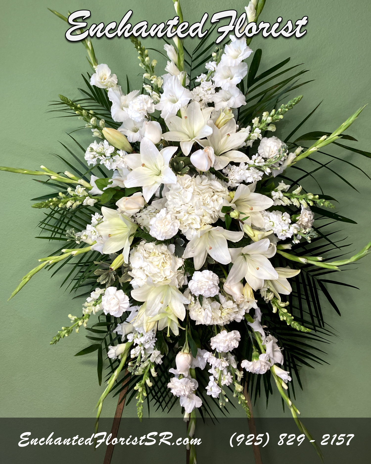 Heavenly - Standing Spray - A serene standing spray of flowers that arrives delivered on an easel, showcasing an all-white palette, featuring astatic lilies, hydrangeas, roses, gladiolas, snapdragons, stock, and carnations.  Standing proud at around 6 feet tall, standing sprays are a meaningful way to honor and celebrate a life well-lived. They are a symbol of comfort and solace during a time of loss. Whether sent as a gesture of condolence or displayed as a tribute at a memorial service, standing sprays offer a comforting reminder that love and remembrance endure, bringing solace during moments of sorrow and loss.  Arrives On: Wooden easel  Orientation: One-Sided  Approximate Dimensions: Height (spray): 38" Height (on easel): 6' Width: 28"