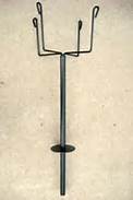 Metal plant stand with a tall central pole and four wire arms