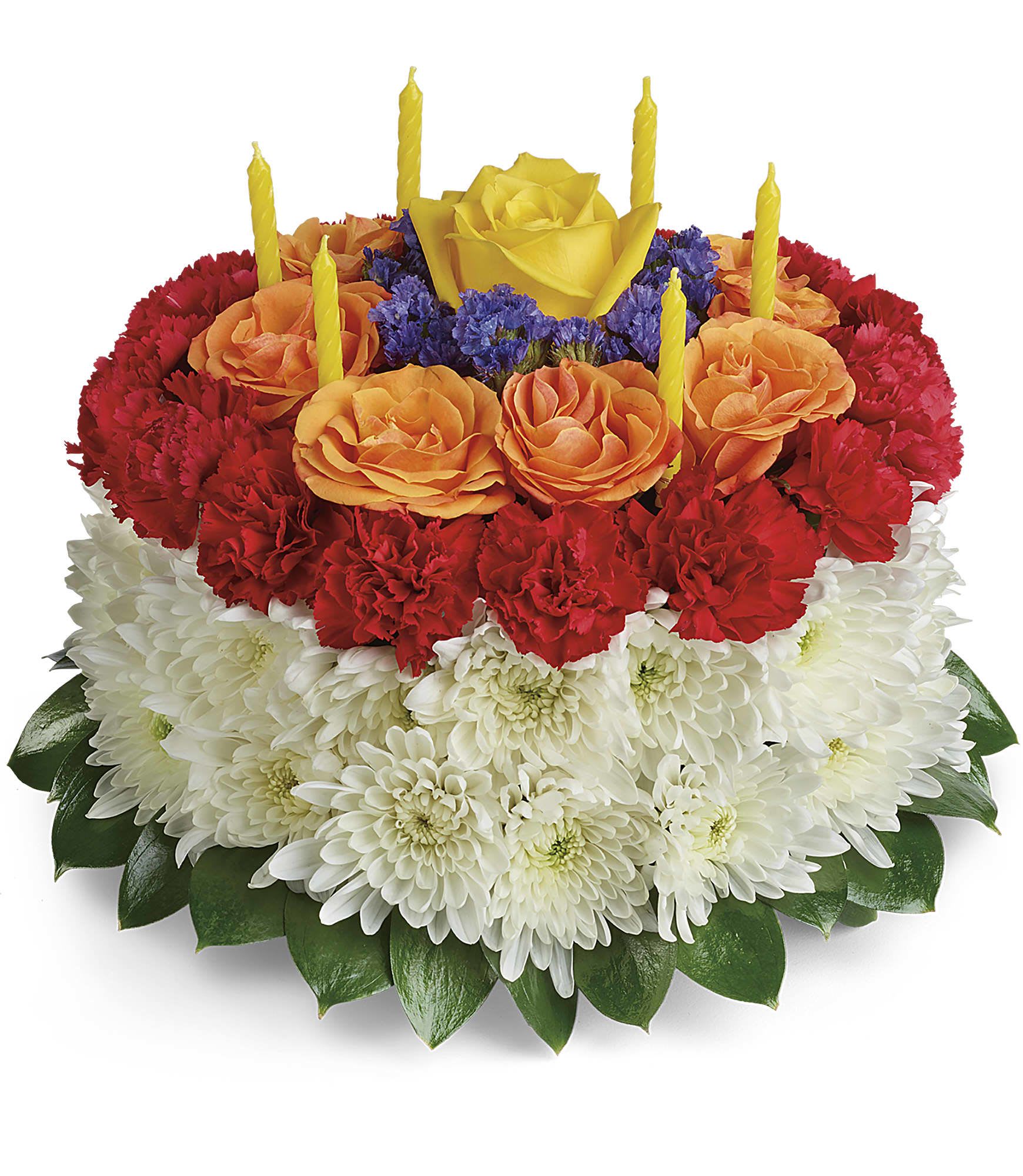 Round floral cake with red, orange, and white flowers and yellow candles