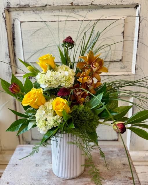 Designer's Choice- Modern - This modern  arrangement in a corrugated metal pot lets the unusual flower varieties, foliage and design speak for themselves. Flower assortment may vary slightly from week to week based on our freshest inventory but the design will always be fun and quirky.