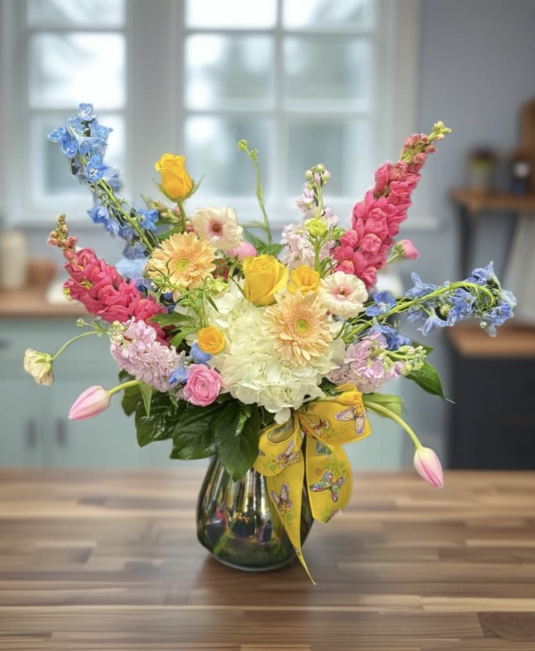 Pastel Daydream - Invite a breath of fresh air and effortless beauty with this charming garden-inspired arrangement. Featuring soft pastel gerbera daisies, lush hydrangeas, fragrant stock, delicate snapdragons, and airy blue delphiniums, it captures the essence of a dreamy spring-to-summer garden. Designed to brighten any space with joy, warmth, and timeless elegance, this bouquet is perfect for celebrating life’s sweetest moments.