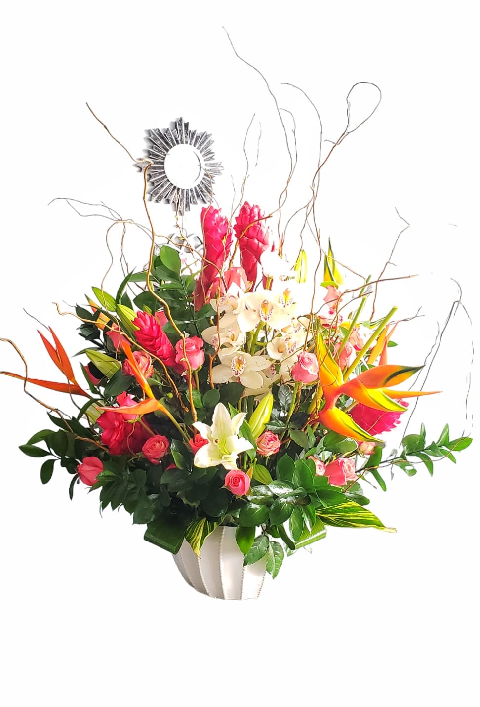 Tropical bouquet with pink orchids, roses, and orange bird-of-paradise in a white vase