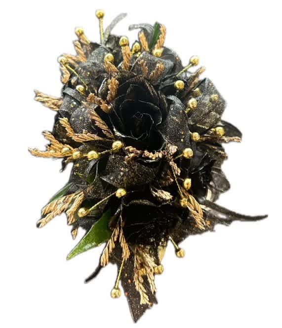 Black floral corsage with gold accents on a white background
