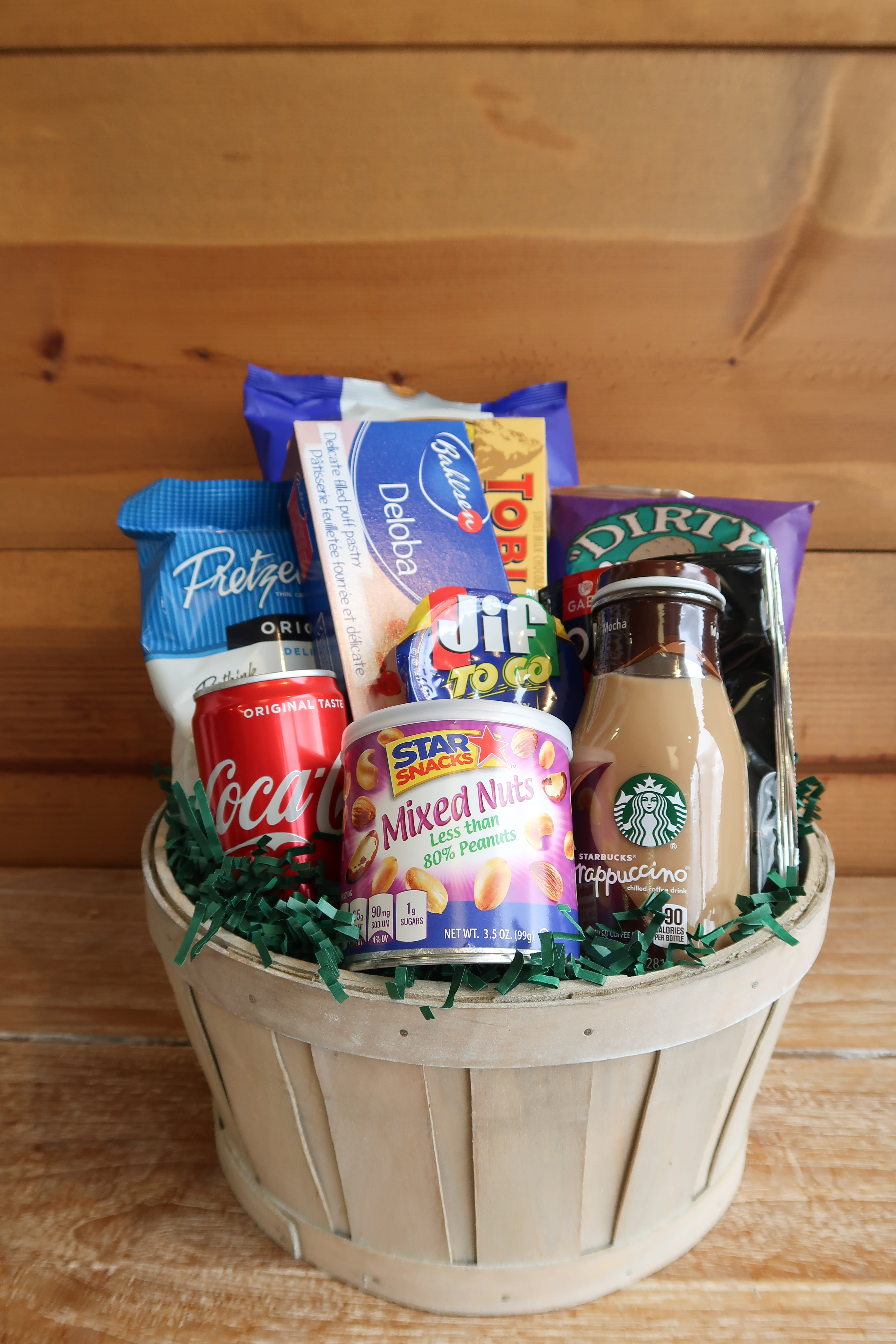 #1 Dad Gift Basket - The perfect care package for any dad who loves to snack! This basket includes chips, olives, chocolate, peanuts, cookies, drinks and a Father’s Day Balloon. 