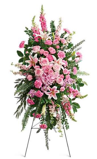 Glorious Farewell Spray -  Pet Friendly? No - This arrangement contains Oriental Lilies, which are highly toxic to cats.  Keep out of reach; avoid homes with curious cats or household pets.   Human Allergy Note : Contains pollen-heavy Oriental Lilies and Snapdragons.  Keep the arrangement in a well-ventilated area and avoid placing it near anyone with known floral sensitivities.   Care &amp; Longevity : As this is a foam-based spray, please mist the back of the arrangement and the central foam block daily with cool water. Keep the display in a cool area away from direct sunlight, heating vents, or harsh drafts to help the blooms stay hydrated and vibrant for the duration of the service.   Best Occasions &amp; Situations : - Funeral service - Celebration of life - Memorial ceremony - Graveside service - Tribute to a matriarch - Church altar display   Why Customers Love It : - Impressive Stature: Standing over four feet tall, it makes a significant visual impact. - Feminine Palette: The soft pink tones offer a gentle and loving aesthetic. - Textural Variety: A rich mix of spikes, clusters, and round blooms creates visual depth. - Ready to Display: Comes pre-mounted on a wire easel for immediate setup.