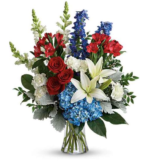 Colorful Tribute Flower -  Pet Friendly? No . This arrangement contains Asiatic Lilies, which are highly toxic to cats and can cause kidney failure.  It also includes Delphinium and Hydrangea, which can be harmful to household pets if ingested. Keep out of reach; avoid homes with curious cats.   Human Allergy Note : This arrangement contains pollen-heavy Asiatic Lilies and Delphinium. If the recipient is sensitive to pollen, we recommend carefully trimming the yellow anthers from the lilies as they open and keeping the vase in a well-ventilated area away from bedding.   Care &amp; Longevity : To keep these bold blooms fresh, trim the stems at a 45-degree angle upon arrival and place them in a clean vase with room-temperature water. Change the water entirely every two days, ensuring no leaves are submerged below the waterline.    Best Occasions &amp; Situaions : - Sympathy or Funeral Service - Military Retirement or Honors - Fourth of July Celebration - Memorial Day Tribute - Masculine Birthday Gift - Major Career Achievement - Thinking of You - Celebration of Life   Why Customers Love It : - Patriotic Impact: The striking red, white, and blue theme is perfect for honoring service members. - Impressive Height: Standing over two feet tall, it makes a commanding presence in any room or service. - Multi-Textured Beauty: A sophisticated mix of ruffles, spikes, and velvet-soft petals. - Gift-Ready: Arrives professionally arranged in a classic glass gathering vase.