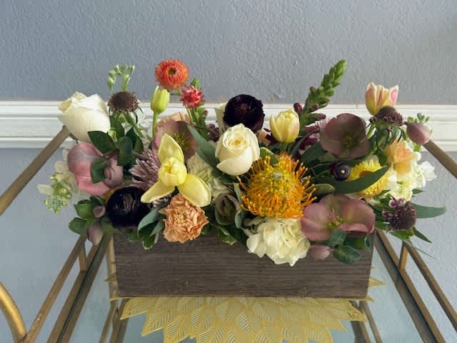 Mixed floral arrangement in a rectangular wooden box