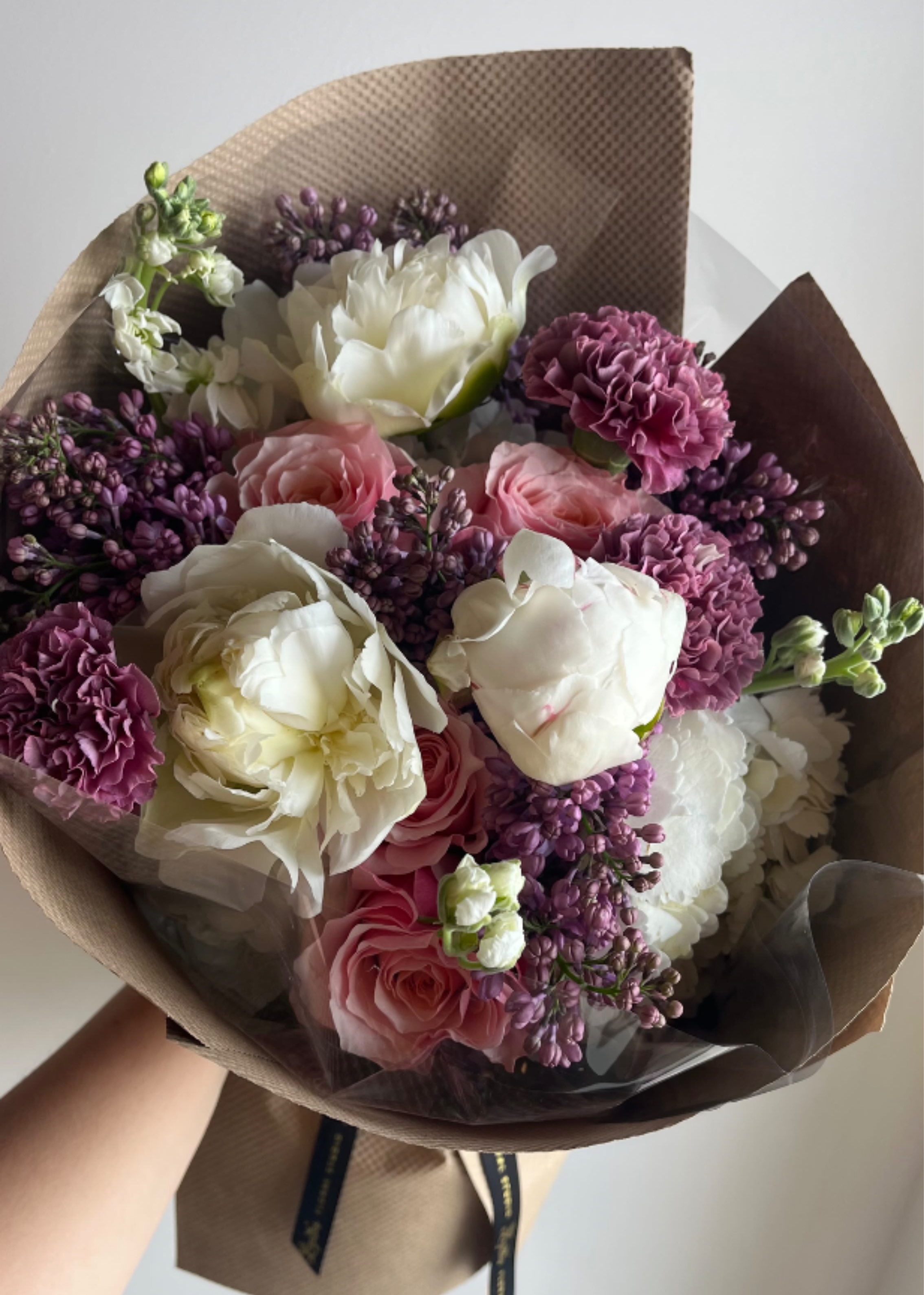 Mother's Day Hand-Tied Bouquet - A soft, garden-style hand-tied Mother’s Day bouquet with locally grown flowers in romantic pastel tones. Fresh, seasonal blooms are beautifully wrapped for a natural, elegant gift—perfect for celebrating Mom with something as lovely as she is.