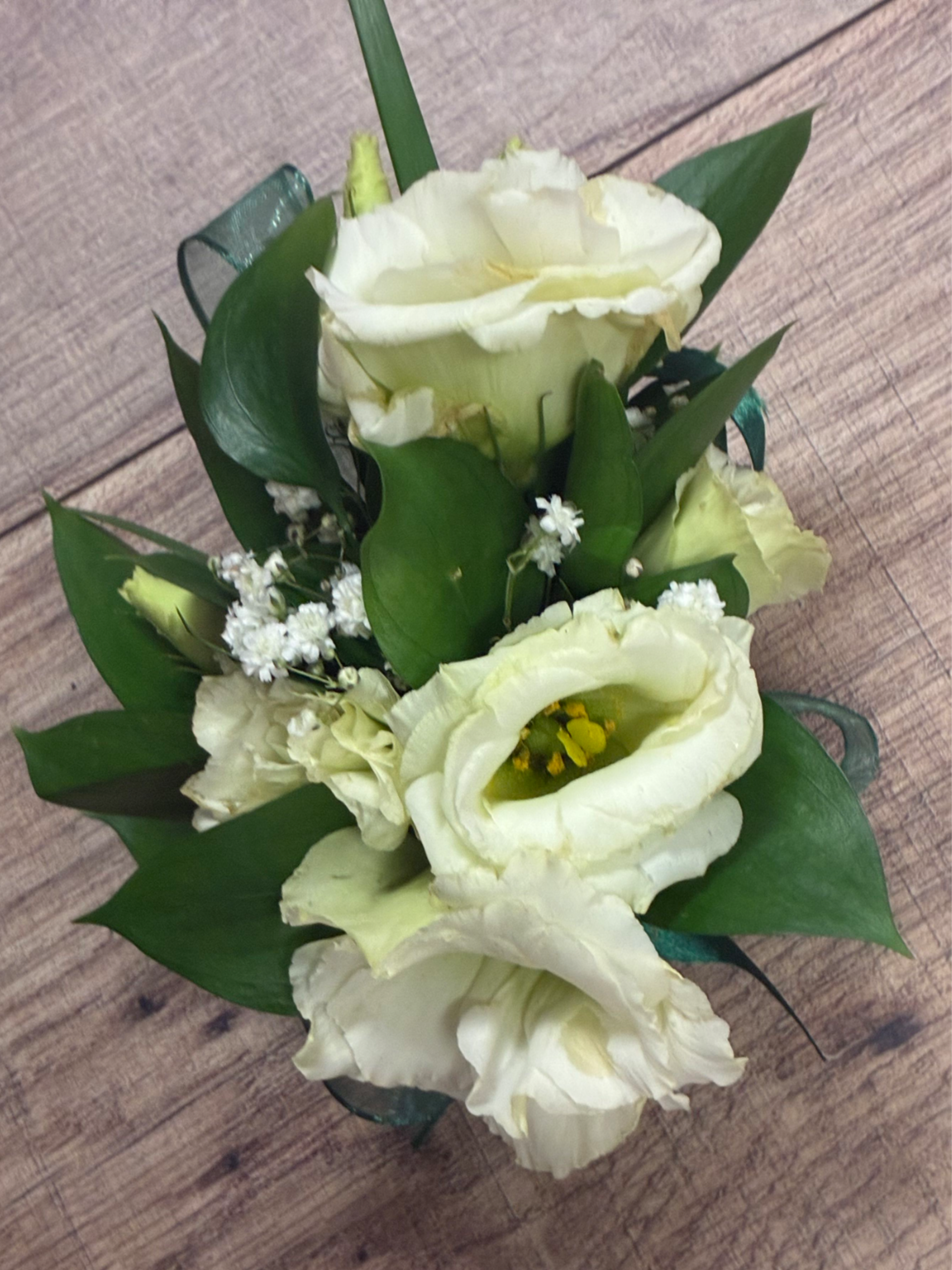 Wrist Corsage - A delicate floral accent featuring 2-4 blooms. 