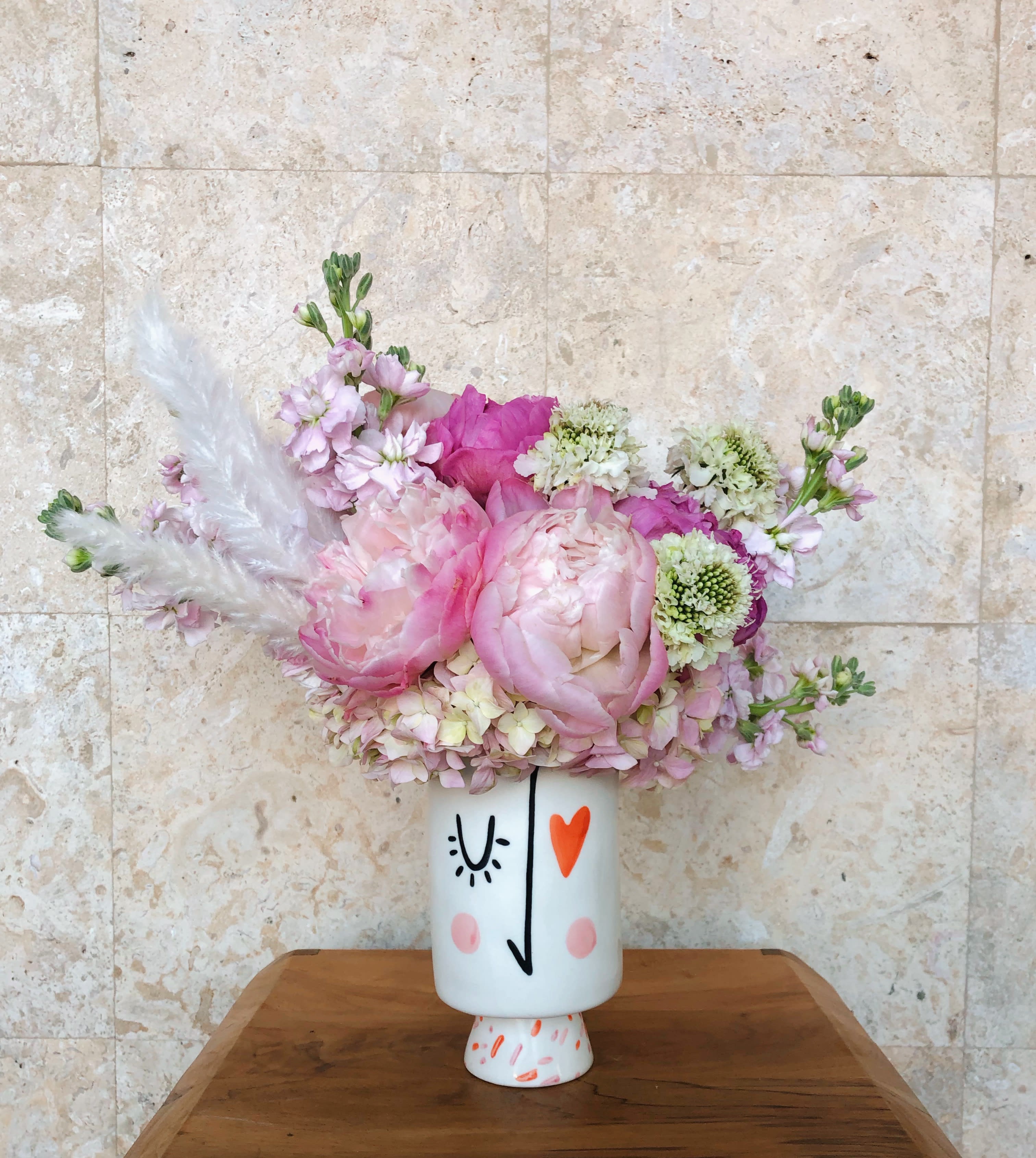 Picaso - Picaso is filled with lush premium flowers of the season and a splash of dry foliage. Perfect for your one of a kind love. 