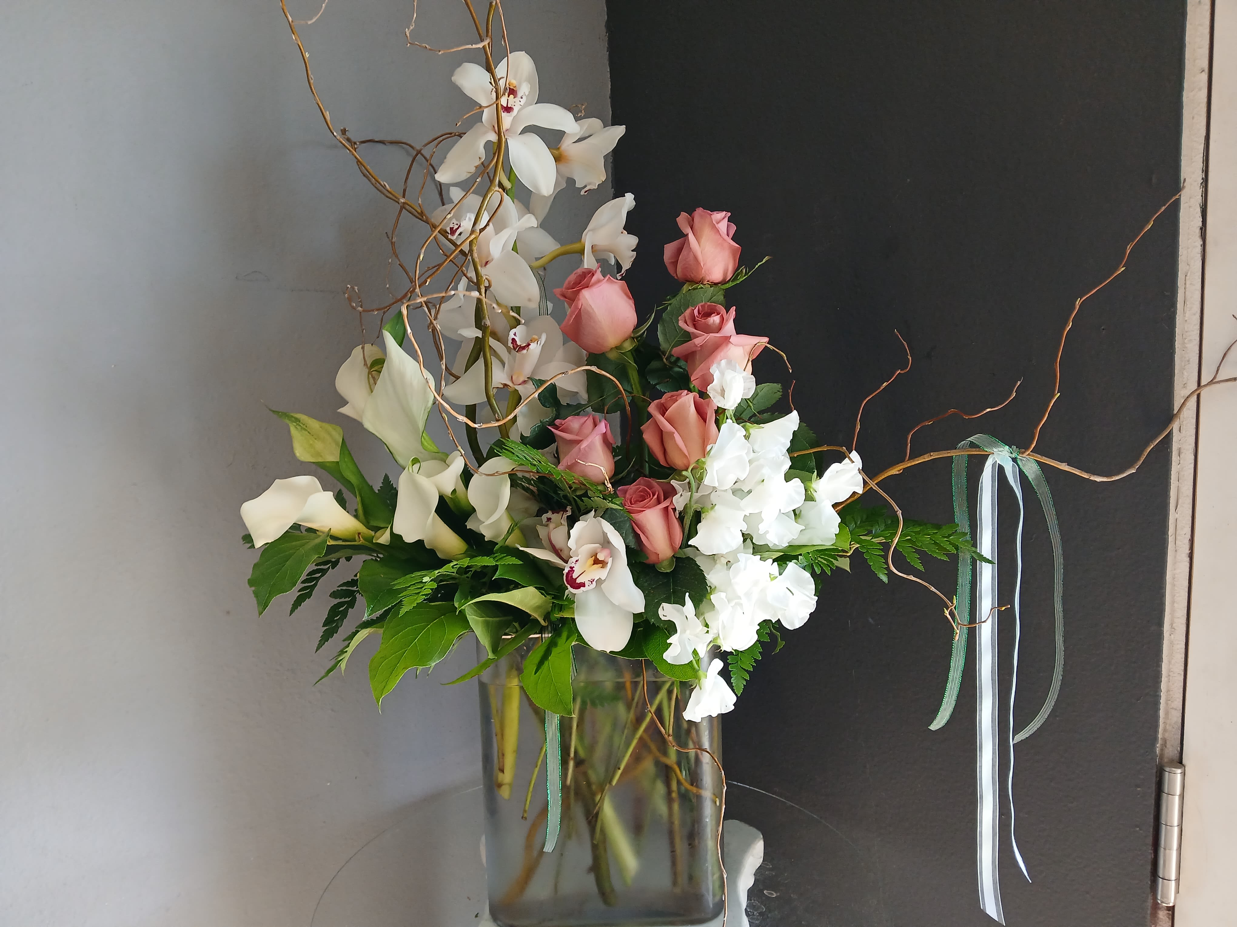 #739 Designer's Choice Vase Arrangement - This beautiful flower arrangement of fresh mixed seasonal blooms is made by local designers in the heart of Orange California. Hand crafted and perfect for every occasion, from birthdays and new babies to sympathy and just because. The best choice to show you are thinking of that special someone. Can be sent as a local delivery or in-store pickup. This is an original, one of a kind arrangement. Order now before it's too late!