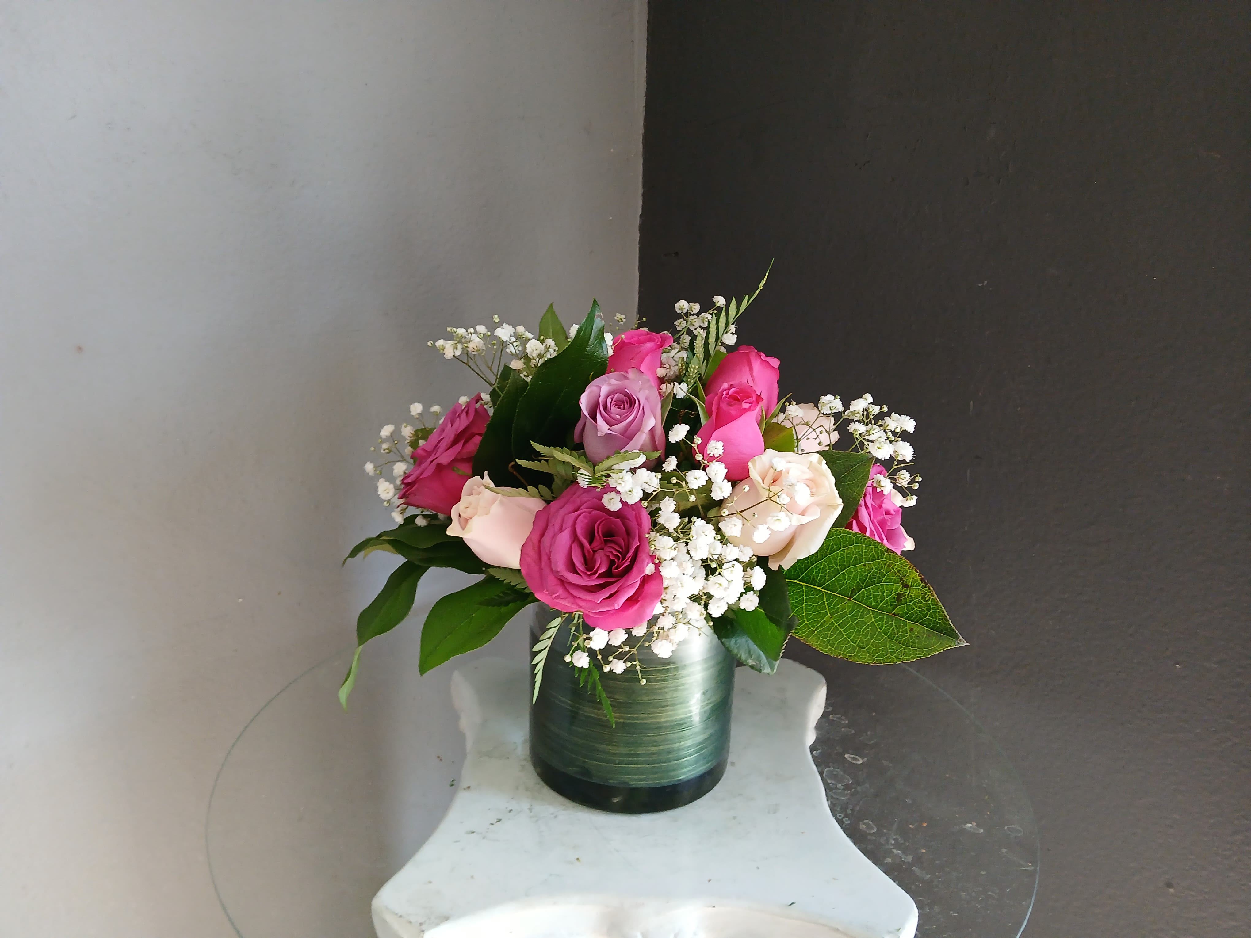 #752 Designer's Choice Vase Arrangement - This beautiful flower arrangement of fresh mixed seasonal blooms is made by local designers in the heart Orange California. Hand crafted and perfect for every occasion, from birthdays and new babies to sympathy and just because. The best choice to show you are thinking of that special someone. Can be sent as a local delivery or in-store pickup. This is an original, one of a kind arrangement. Order now before it's too late!  UPGRADES: All upgrades are applied at the designer’s discretion and fulfilled to value using the freshest seasonal and/or premium flowers available. Container upgrades may be included when possible; otherwise, value is reflected in the floral selection while maintaining the original design style.  