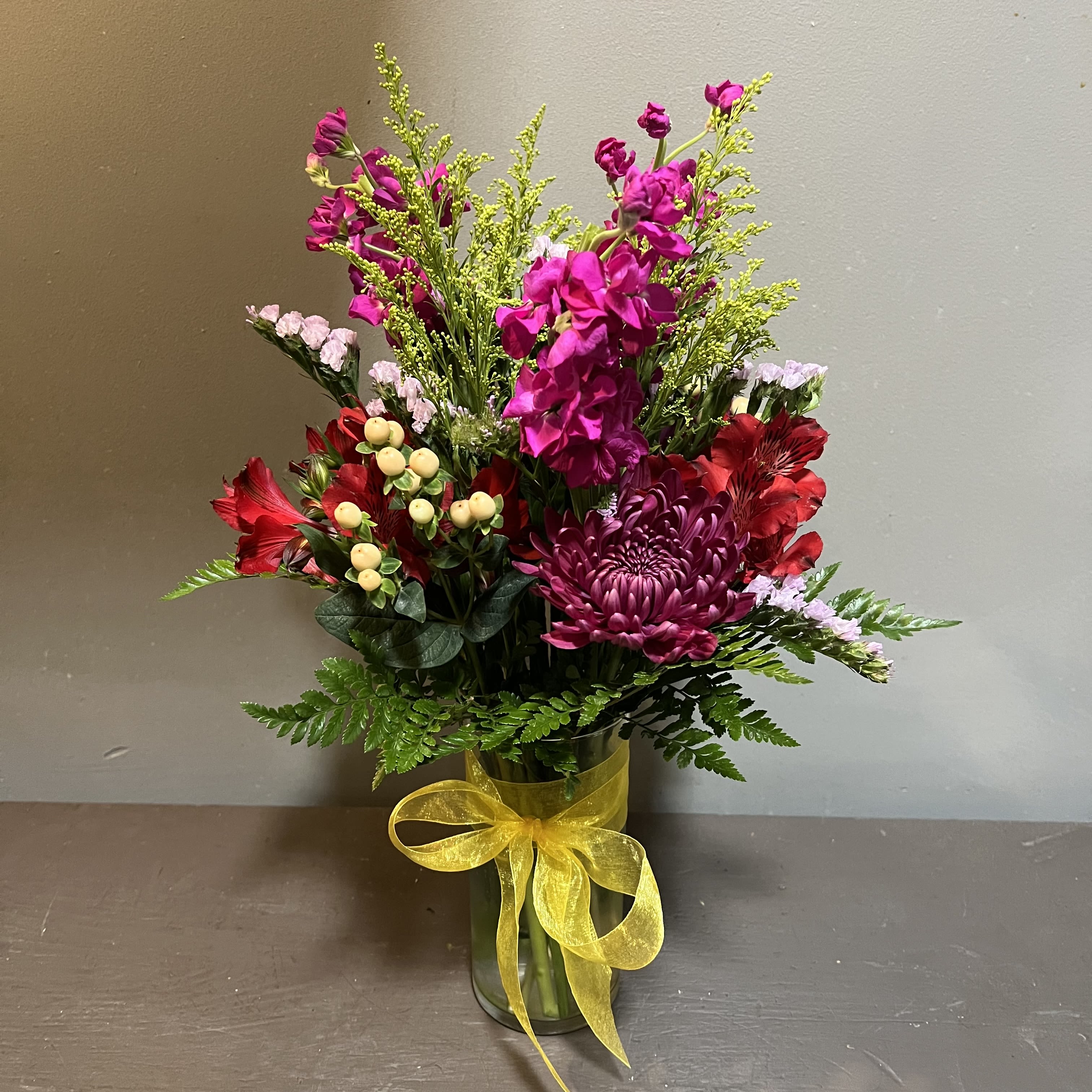 Mid-Height Garden Vase - A garden mix of flowers.  Measures approx. 21" tall x 13" diameter and arrives in a clear glass vase.