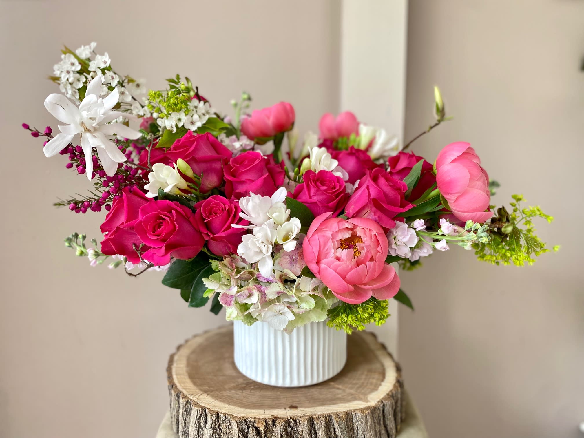 You're a limited edition - We offer this stunning arrangement only during the late Spring/early Summer months when gorgeous peonies are in season. It's one of our favorite arrangements of the season! Beautiful pink roses and peonies, complimented with filler flowers will come arranged in a ceramic vase. You can't go wrong with this one! 