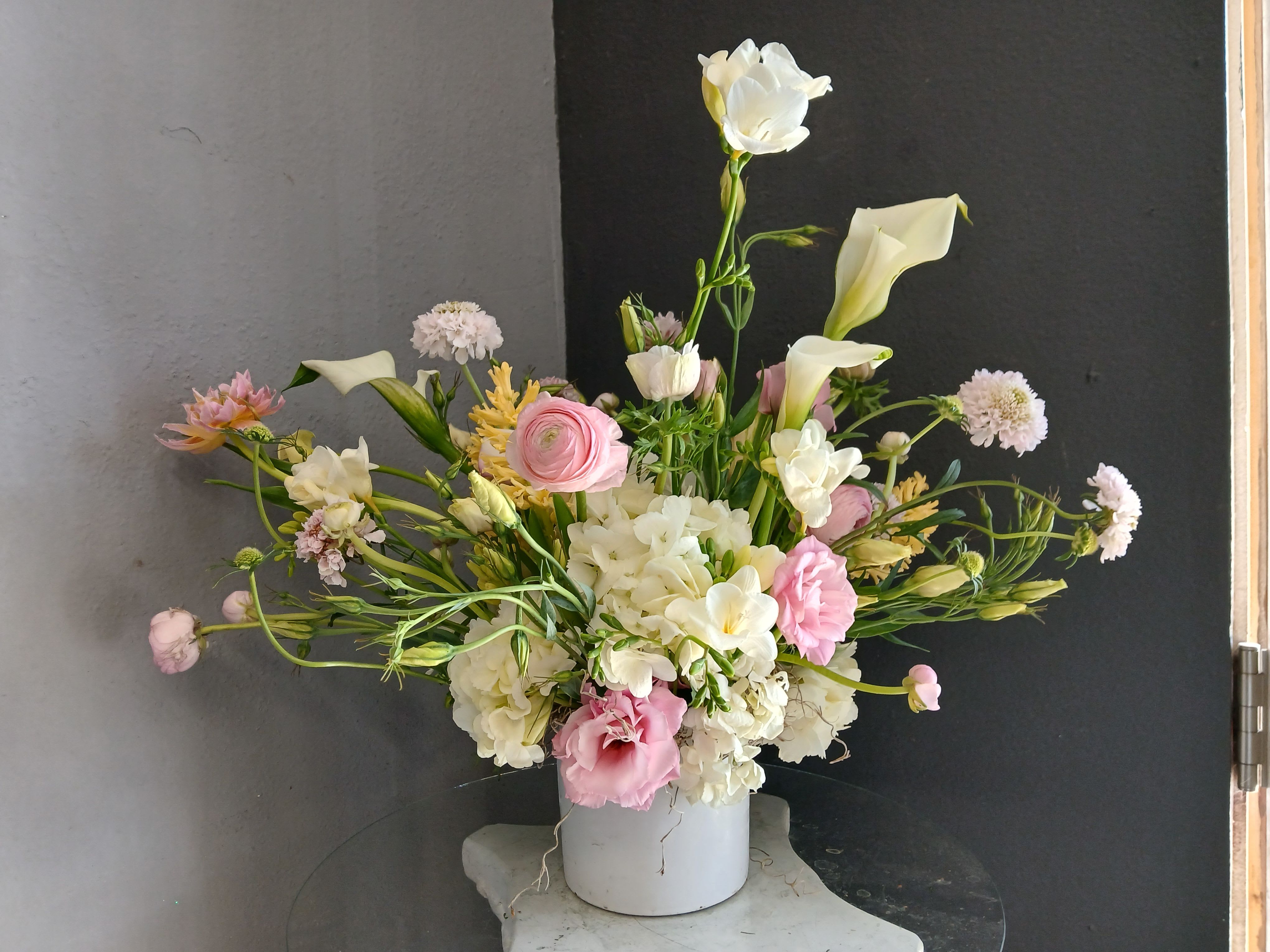 #738 Designer's Choice  - This beautiful flower arrangement of fresh mixed seasonal blooms is made by local designers in the heart Orange California. Hand crafted and perfect for every occasion, from birthdays and new babies to sympathy and just because. The best choice to show you are thinking of that special someone. Can be sent as a local delivery or in-store pickup. This is an original, one of a kind arrangement. Order now before it's too late! 