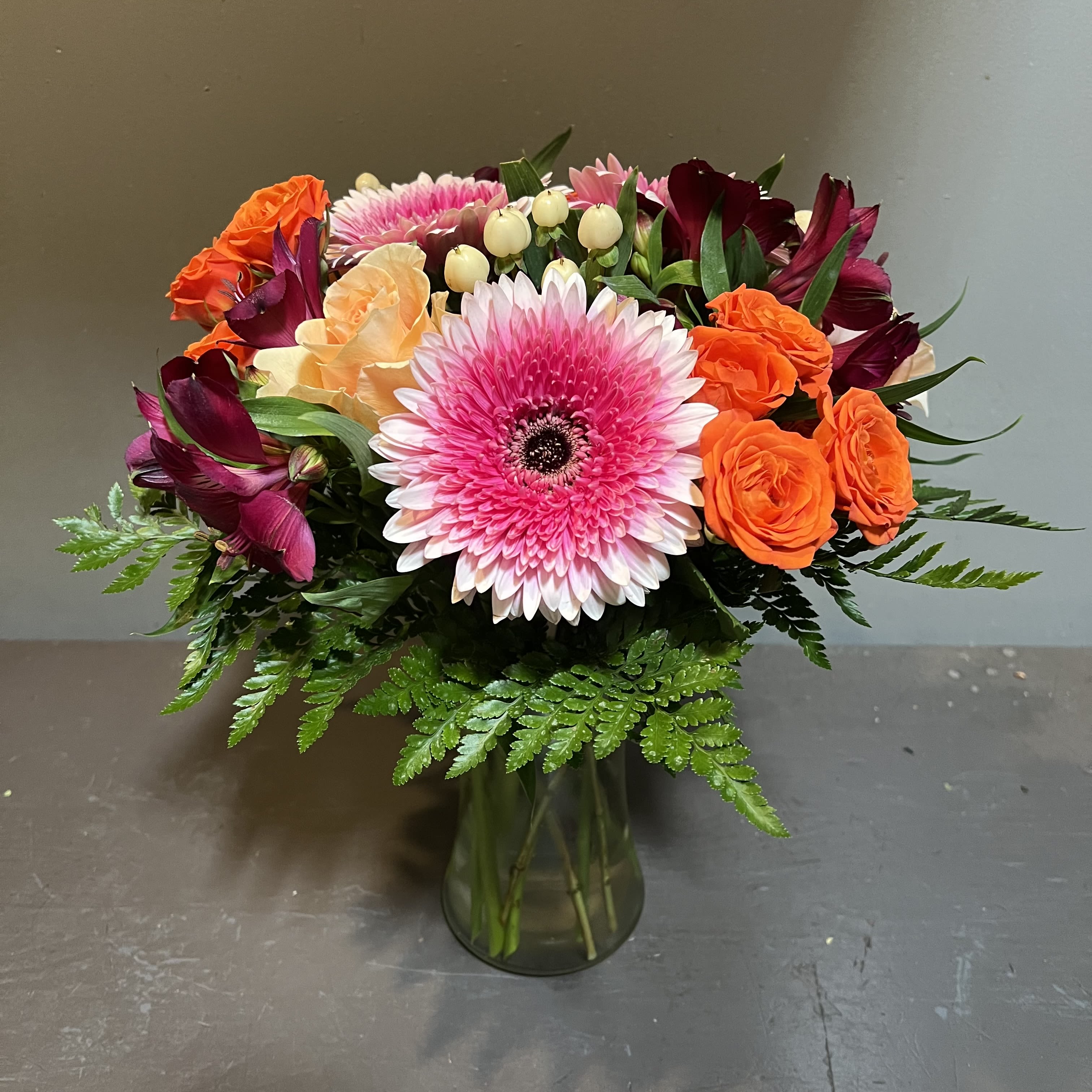 Chic and Unique  - A stunning, vibrant bouquet to welcome Spring!  Measures approx. 17"Tx14"W and arrives in a glass vase.