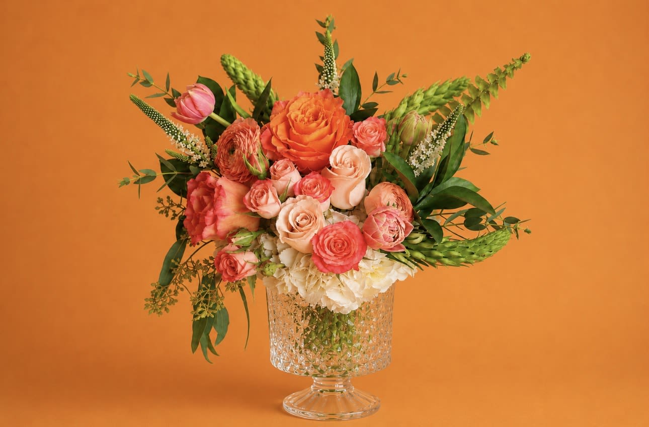Peach &amp; Coral Garden | DFW Local Florist - Our Peach &amp; Coral Garden—a fresh, garden-style arrangement designed in warm peach, coral, and blush hues.  This design is perfect if she loves soft, feminine colors with a fresh spring feel. Our designers will create an arrangement inspired by this look using premium, seasonal blooms in the same color palette and overall size.  Each arrangement is artistically designed and one-of-a-kind, so exact flowers may vary based on the freshest stems available—but the color story, fullness, and elevated style will always be honored.   Best for: Peach, coral, blush lovers  Style: Soft, airy, garden-inspired  Delivery: Available across Dallas–Fort Worth