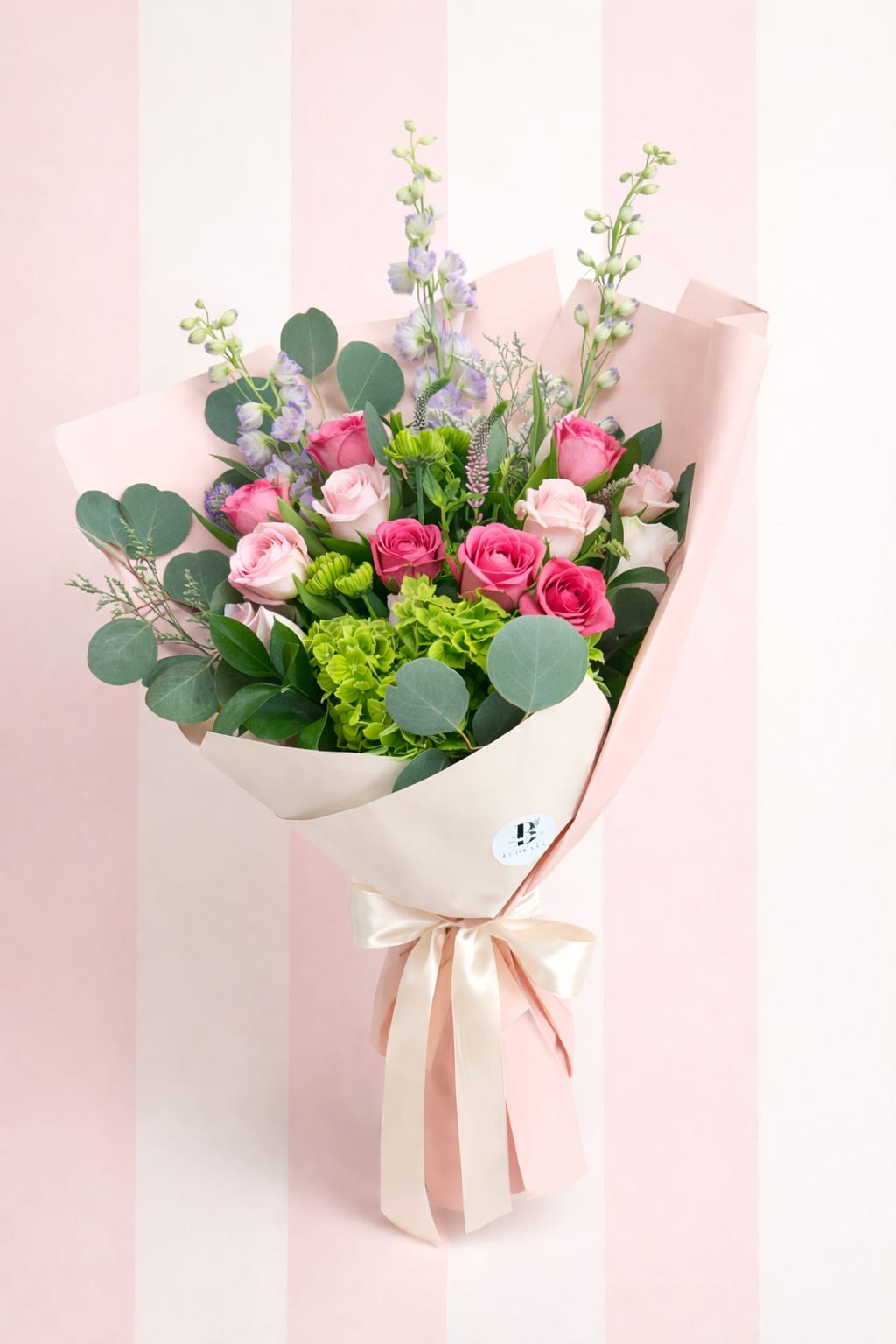     The Bloom Bundle  - Need a beautiful gift in a hurry? Our Designer’s Choice Hand-Tied Bouquet is the perfect last-minute floral option for Mother’s Day, birthdays, anniversaries, or just because. For $85, our floral designers will create a lush wrapped bouquet featuring fresh roses, premium gerbera daisies, seasonal greenery, and complementary filler flowers in a stylish hand-tied presentation.  Each bouquet is uniquely designed using the freshest blooms available in our shop that day, making every arrangement one-of-a-kind.   Perfect for customers searching for a quick, beautiful flower bouquet from your local DFW florist.
