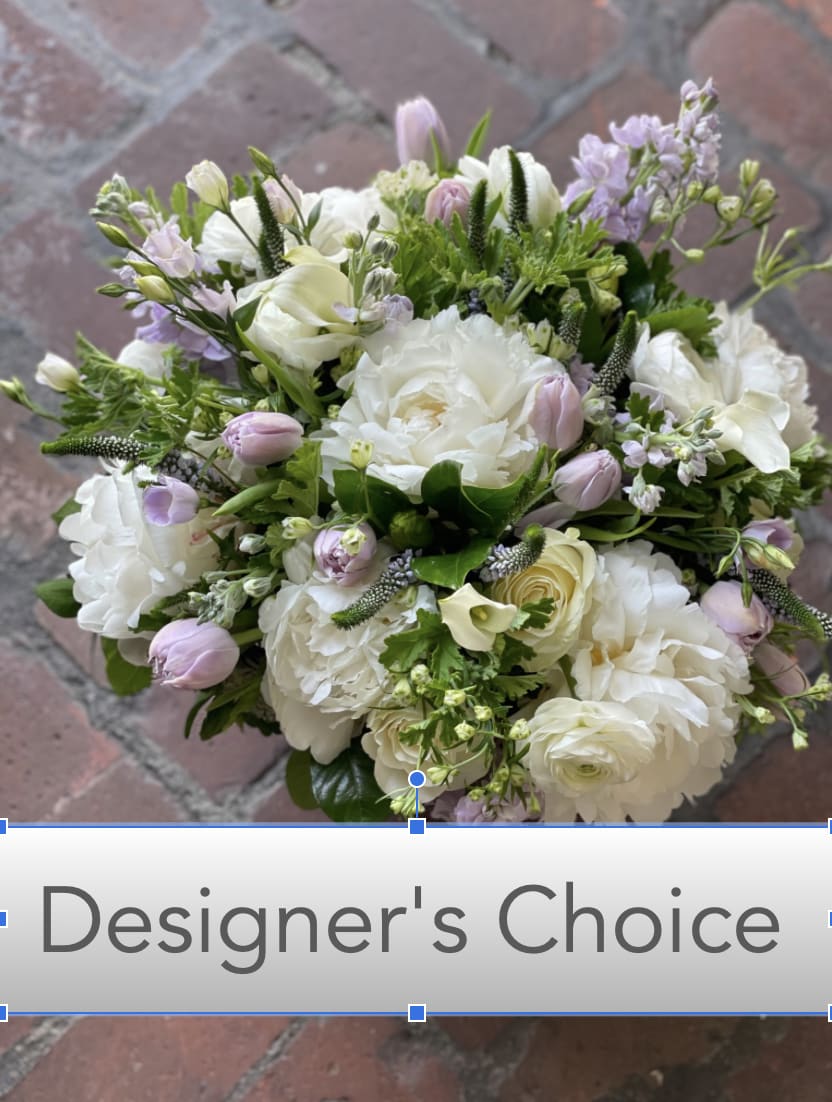 Bouquet of white and pale pink flowers with a designer's choice label