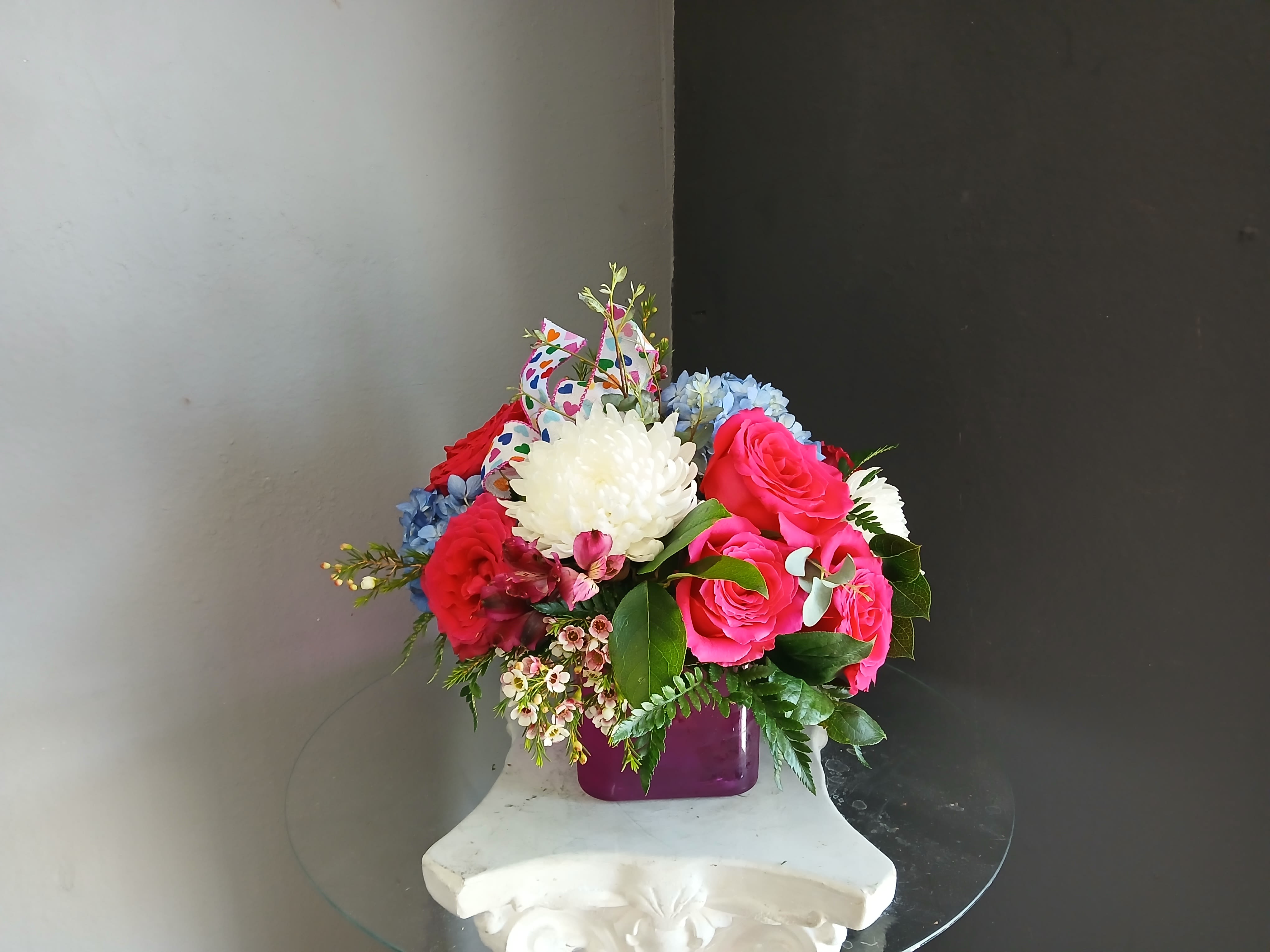 #748 Designer's Choice vase arrangement  - This beautiful flower arrangement of fresh mixed seasonal blooms is made by local designers in the heart of Orange California. Hand crafted and perfect for every occasion, from birthdays and new babies to sympathy and just because. The best choice to show you are thinking of that special someone. Can be sent as a local delivery or in-store pickup. This is an original, one of a kind arrangement. Order now before it's too late!  UPGRADES: All upgrades are applied at the designer’s discretion and fulfilled to value using the freshest seasonal and/or premium flowers available. Container upgrades may be included when possible; otherwise, value is reflected in the floral selection while maintaining the original design style.  