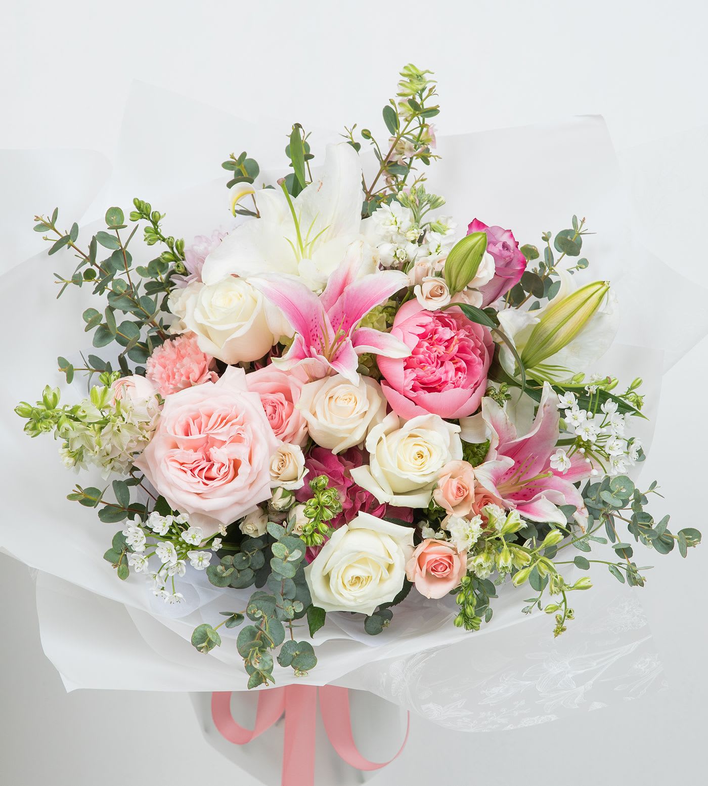 Happy Day - A beautiful mix of soft pink and ivory seasonal blooms bouquet, thoughtfully arranged with fresh greenery and elegant wrapping — perfect for celebrating Mom with love and warmth. #mom #mothersday #mother 